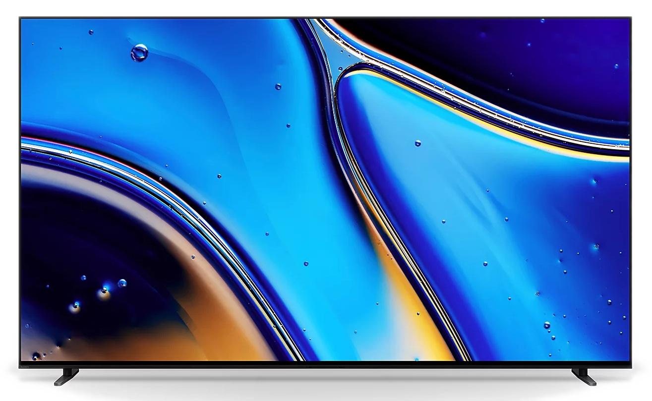 Duży telewizor wyświetla abstrakcyjny wzór wirujących niebieskich, złotych i białych kolorów, przypominający ciecz. Pęcherzyki są rozrzucone po ekranie.