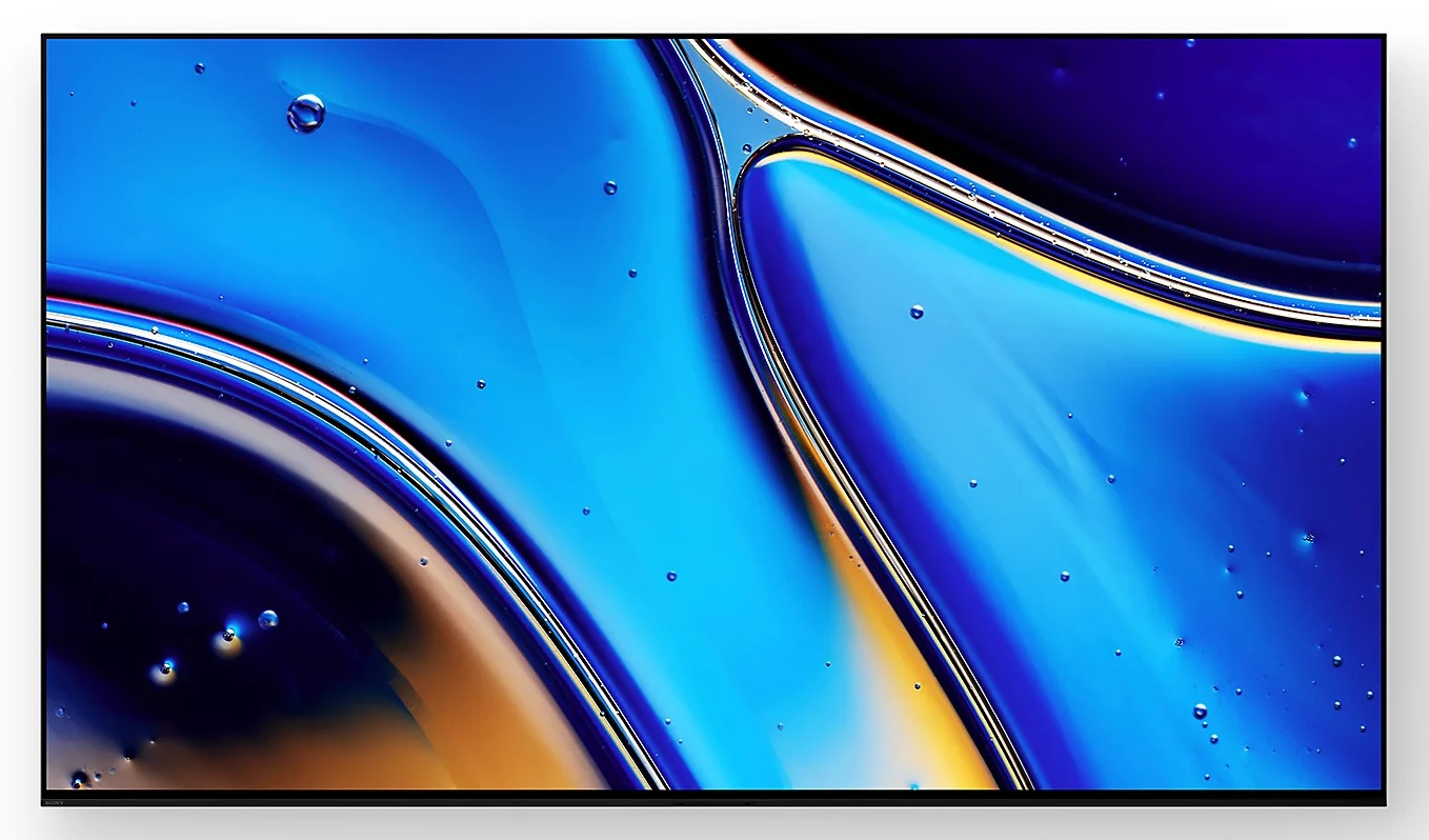 Abstrakcyjny obraz z niebieskimi i złotymi wzorami płynów. Bąbelki unoszą się w cieczy. Czarna ramka otacza obraz.