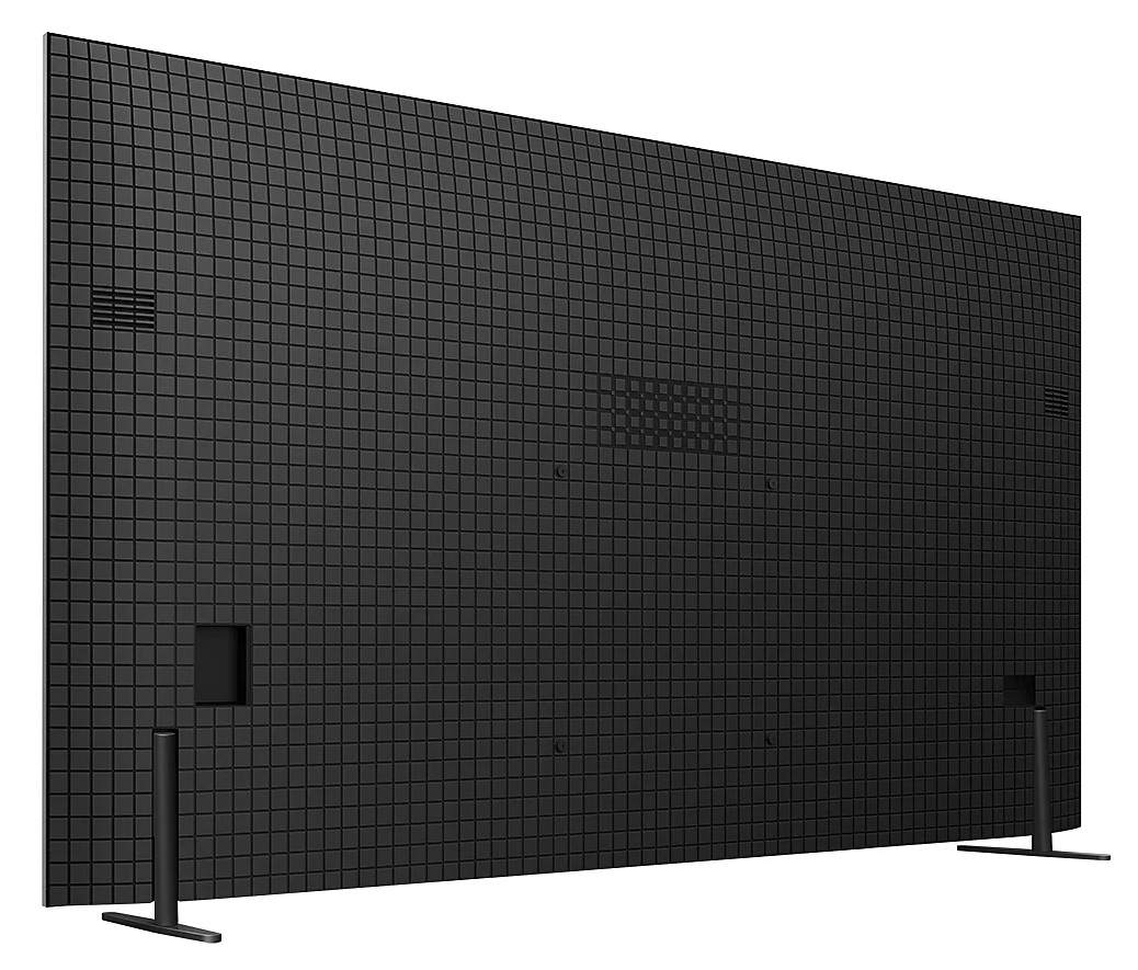 Tył dużego czarnego telewizora z siatką. Ma dwie nogi i różne porty oraz otwory wentylacyjne.