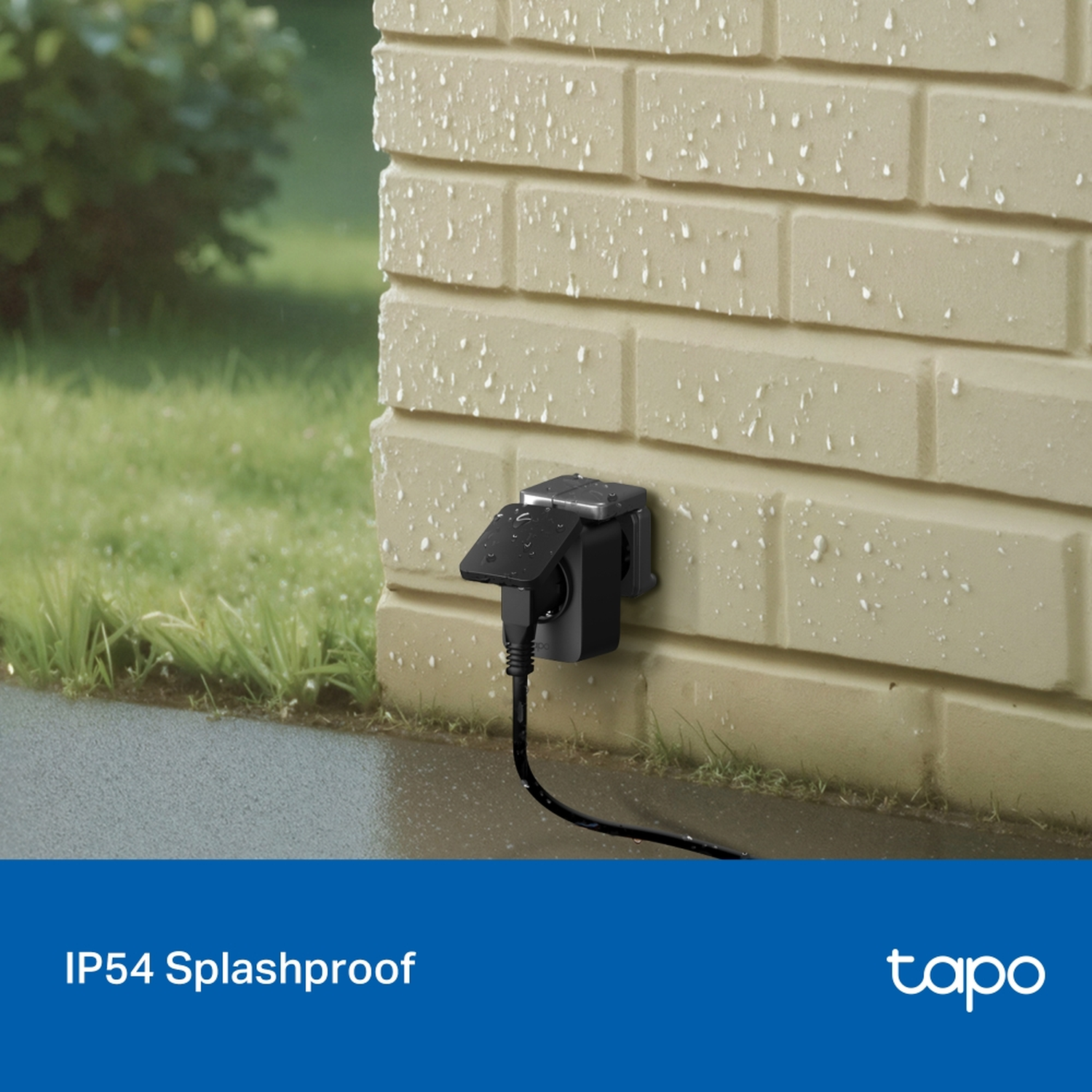 Black outdoor electrical outlet on beige brick wall, with a black cable. Green grass and blue background.