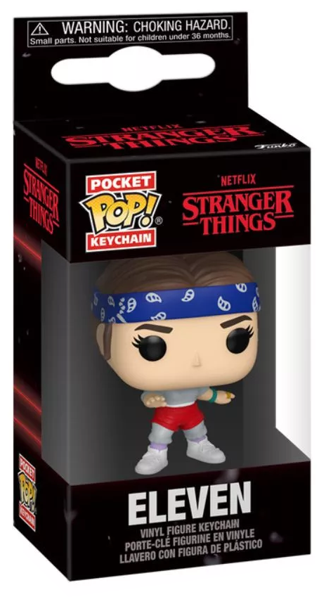 Funko Pop kulcstartó Eleven a Stranger Things-ből. Kék fejpántot, szürke inget, piros sortot és fehér cipőt visel.