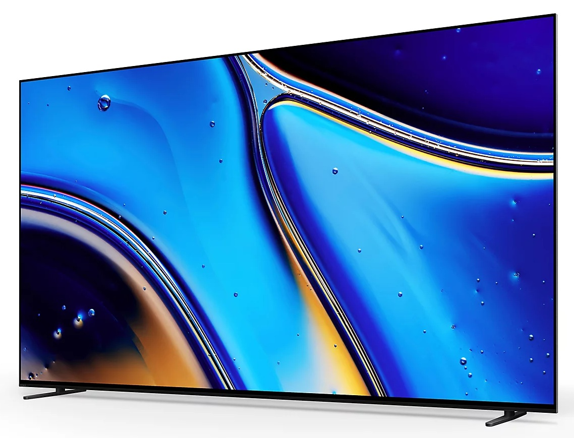 Duży telewizor wyświetla abstrakcyjny niebiesko-żółty obraz. Telewizor ma cienką czarną ramkę i stoi na czarnych nóżkach, na białej powierzchni.