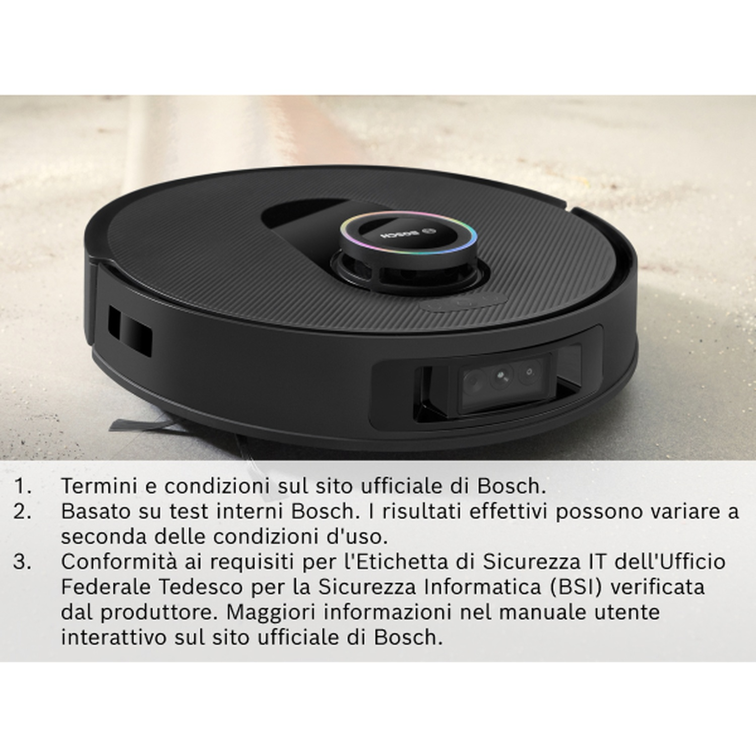 Un aspirapolvere robotico nero su una superficie chiara. Ha una fotocamera e una parte superiore circolare con un anello luminoso.