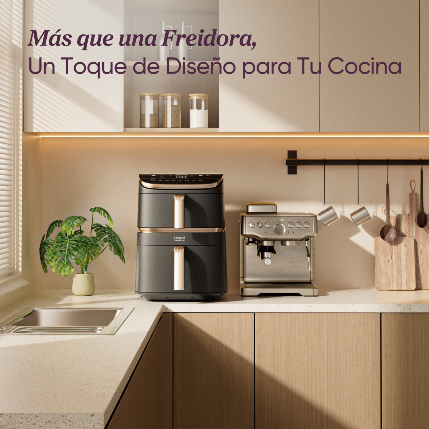 Escena de cocina con freidora, cafetera y utensilios. Texto: Más que una freidora, un toque de diseño para tu cocina.