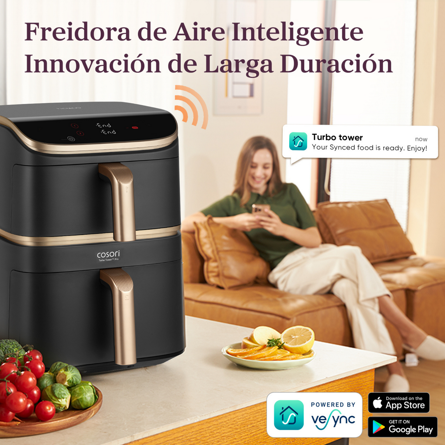 Una freidora de aire con una mujer usando un teléfono. Frutas y verduras cortadas sobre una mesa. Logos de la App Store visibles.