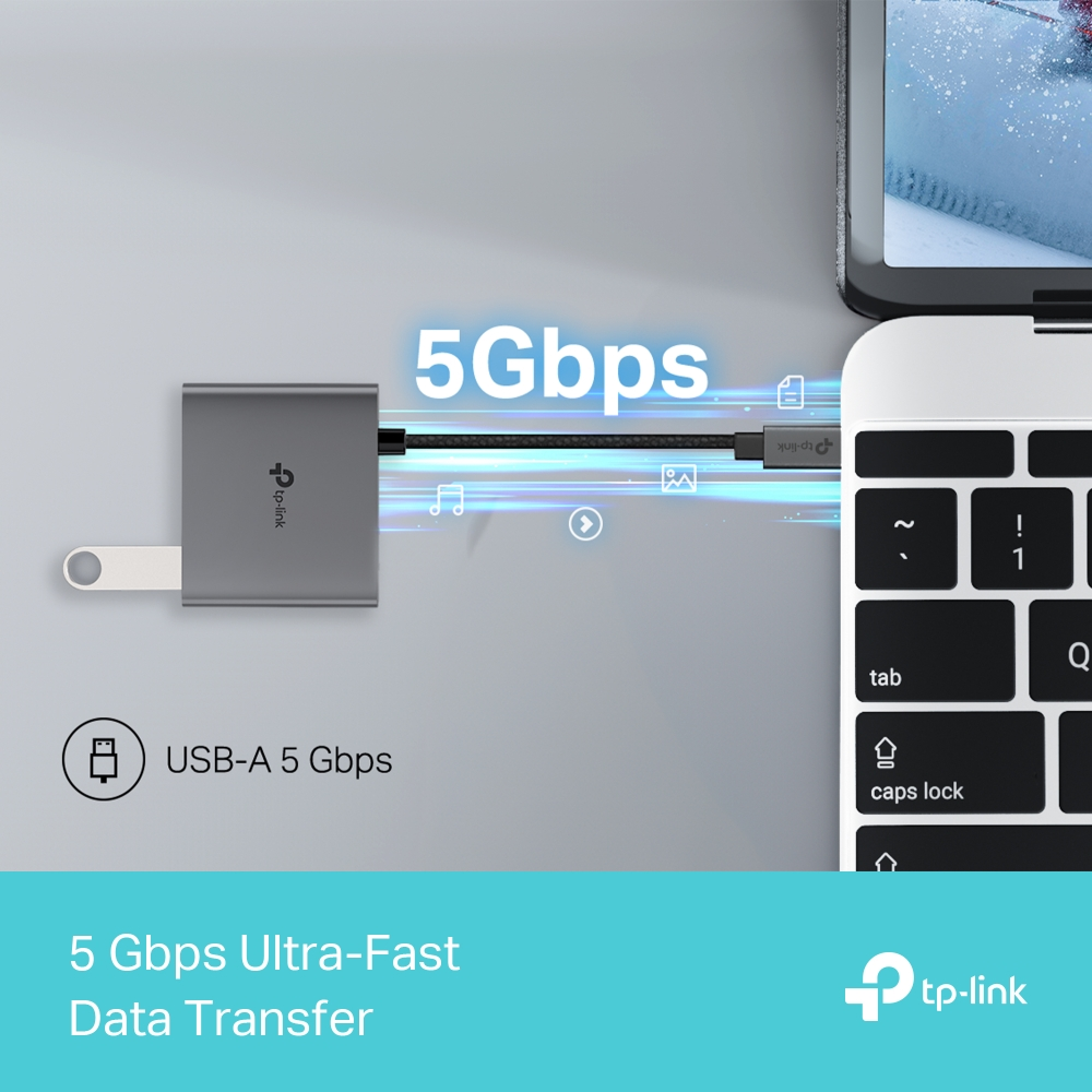 Bir dizüstü bilgisayara bağlı gümüş renkli bir TP-Link USB hub'ı. Metin '5 Gbps Ultra Hızlı Veri Aktarımı' ve 'USB-A 5 Gbps' yazıyor.