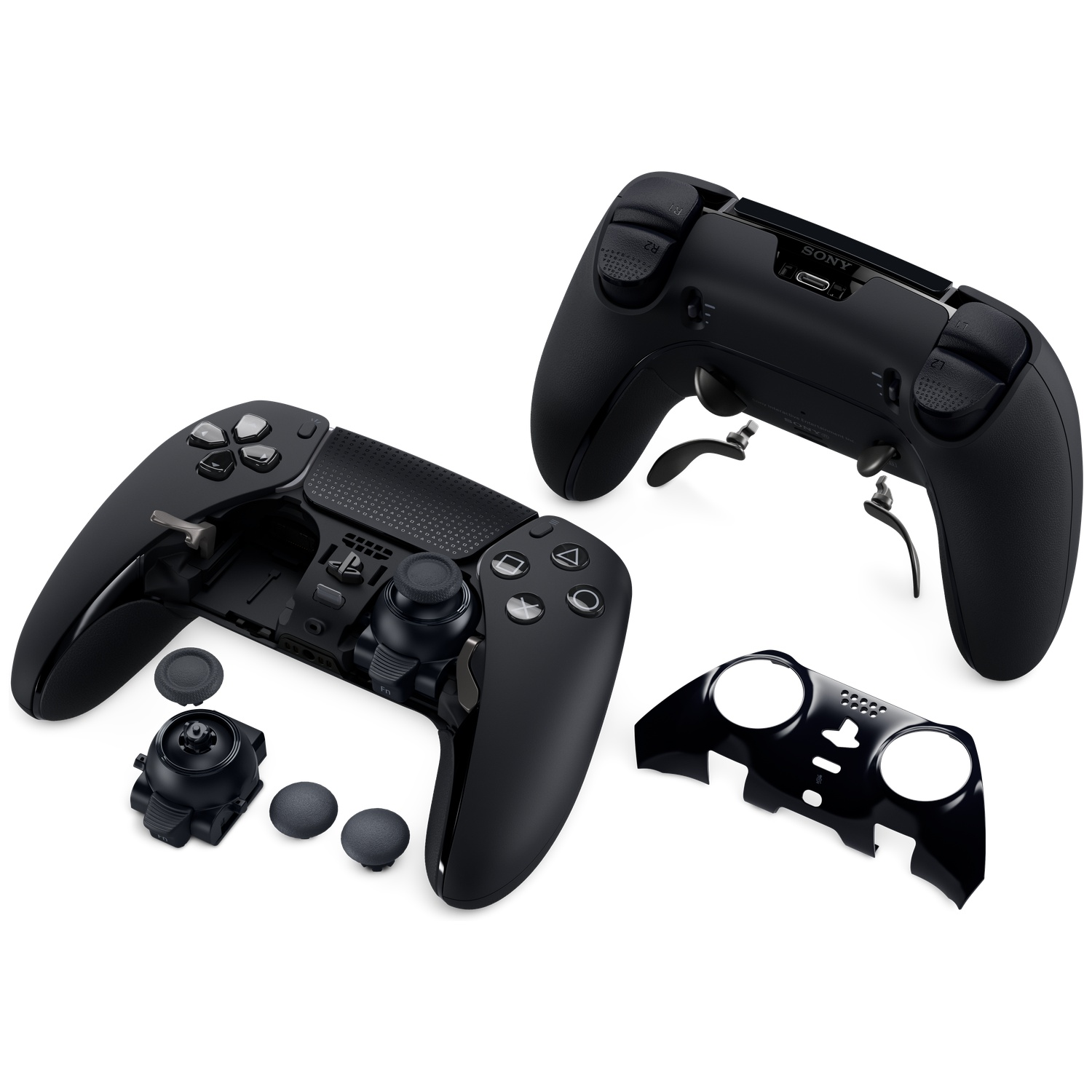 Black disassembled game controller parts on white background. Includes controller body, buttons, and a faceplate.
