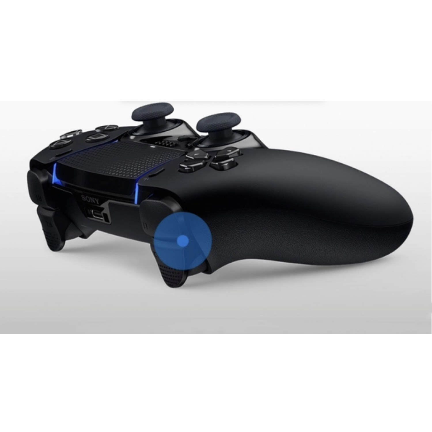 A black PlayStation controller is shown. It has two analog sticks, buttons, and a touchpad. The Sony logo is visible.