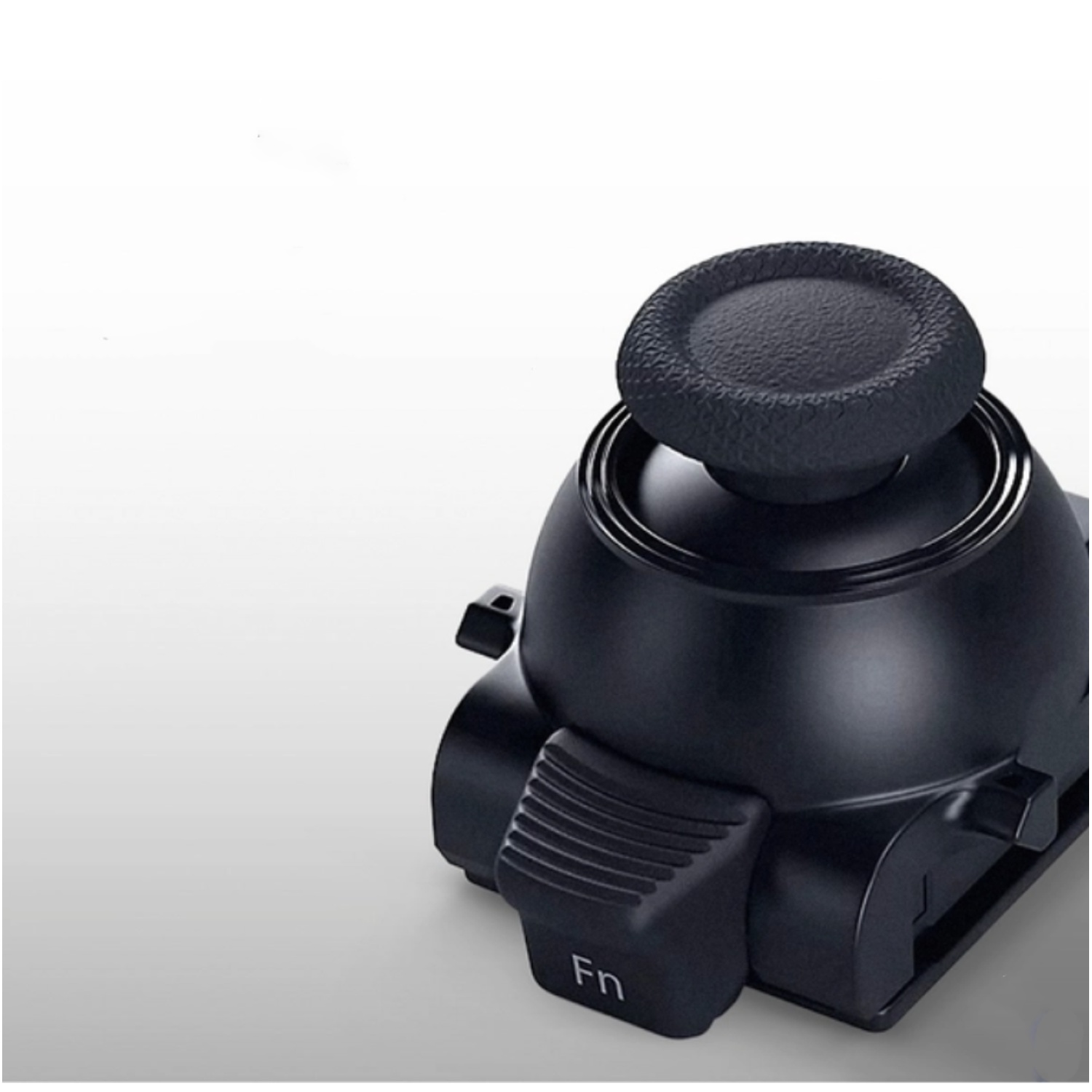 A black keyboard control with a round textured top and buttons labeled 'Fn' on a gradient background.