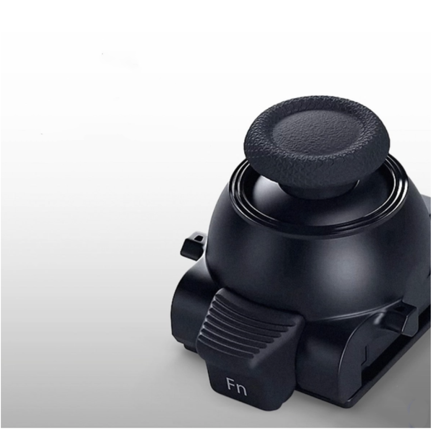 Een zwarte controller met een ronde bovenkant en een 'Fn'-knop, tegen een witte gradiënt achtergrond.