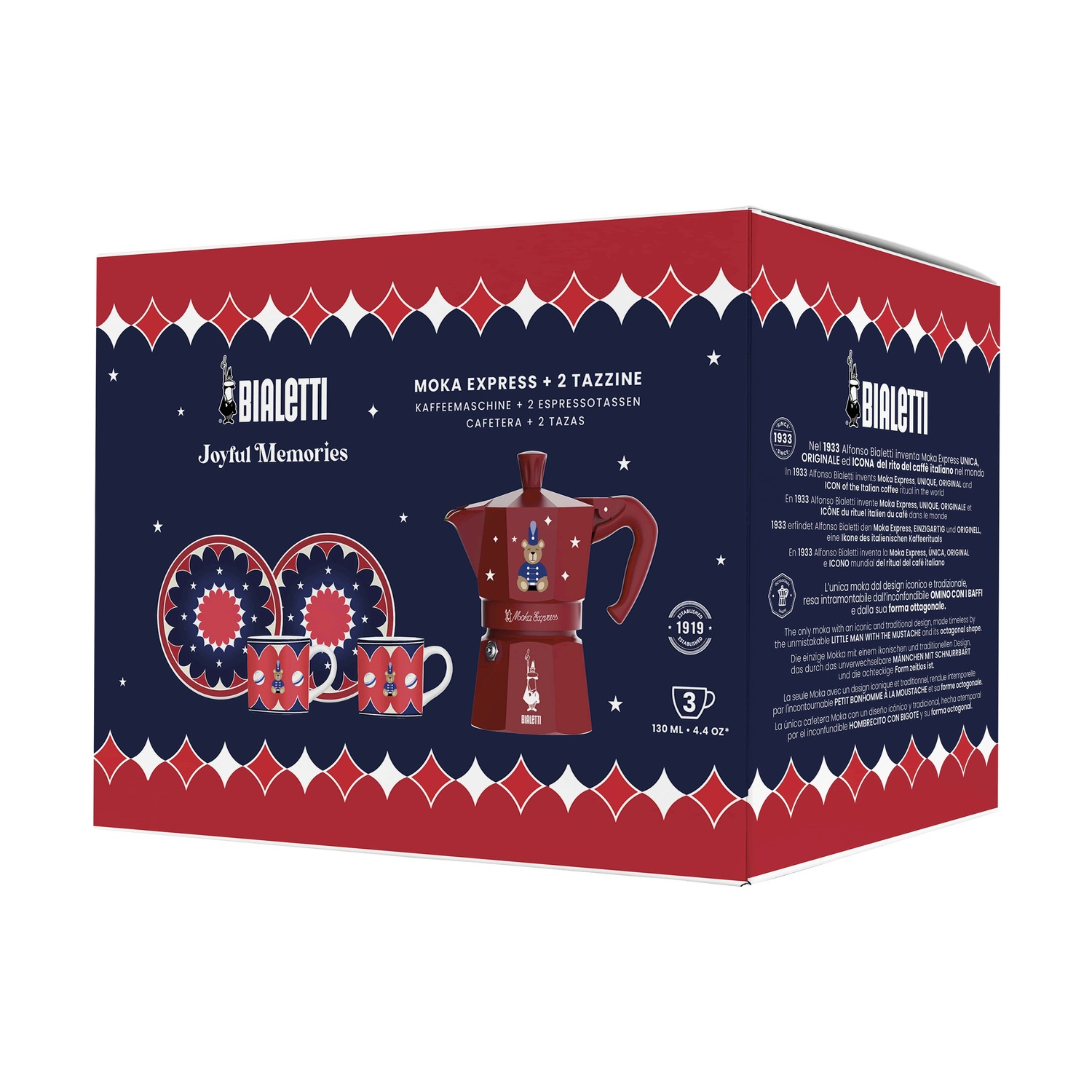 Un set Moka Express Bialetti rosso. Include caffettiera, due tazze e piattini, tutti con un design festivo, su una scatola.