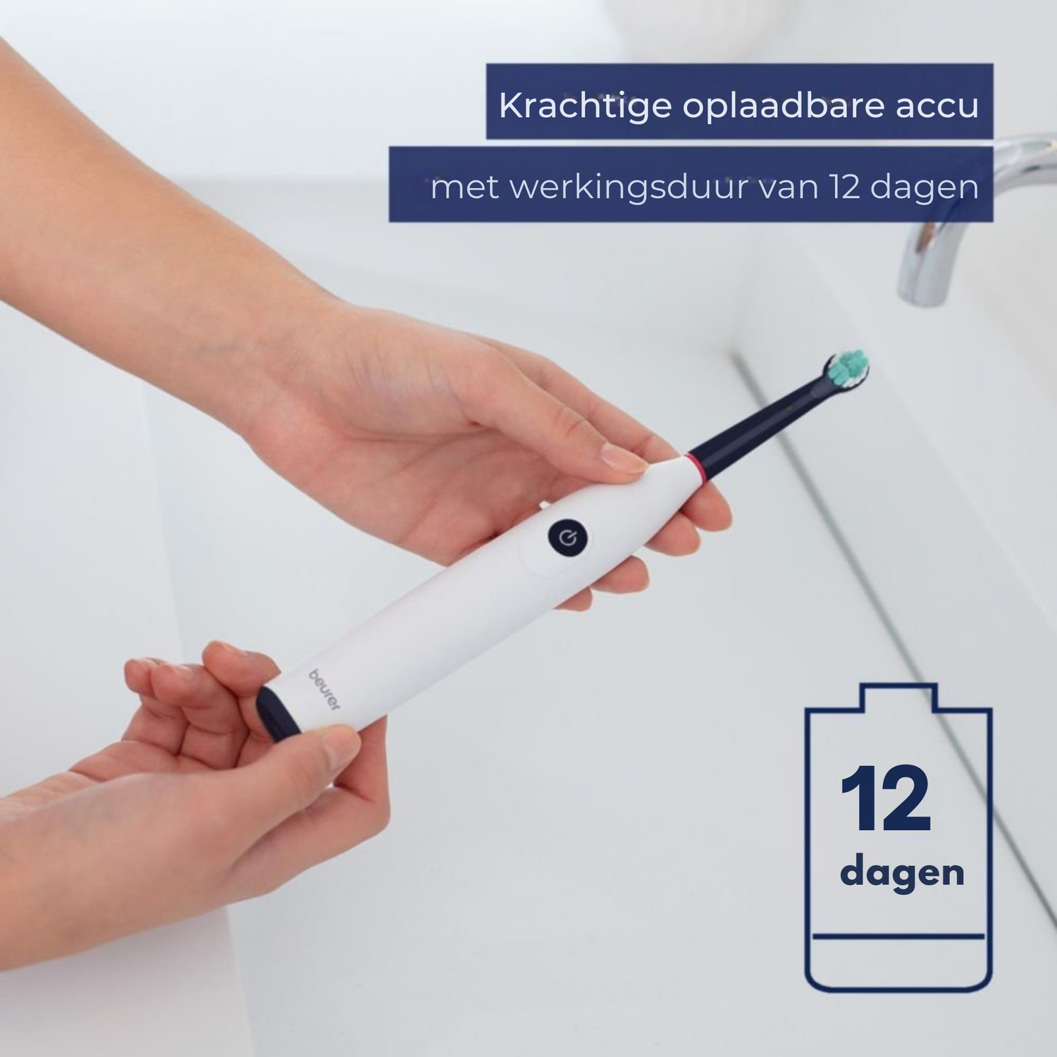 A person holds a white electric toothbrush. Text indicates it has a 12-day battery life. The background is a white sink with a faucet.