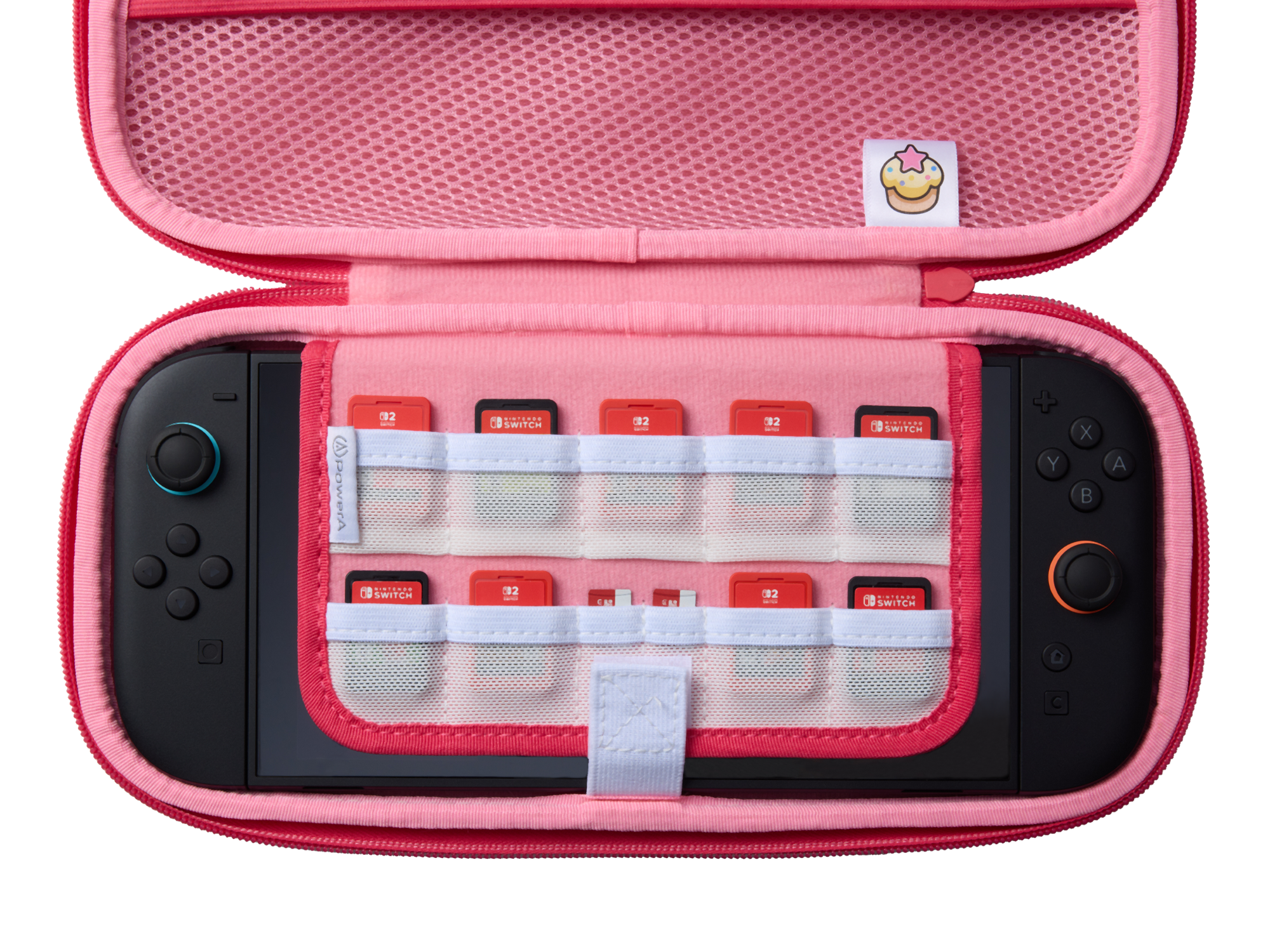 Geöffnete pinke Switch-Hülle mit Switch-Konsole und Spielkassetten. Hülle hat Dessert-Patch. Rote und pinke Farben.