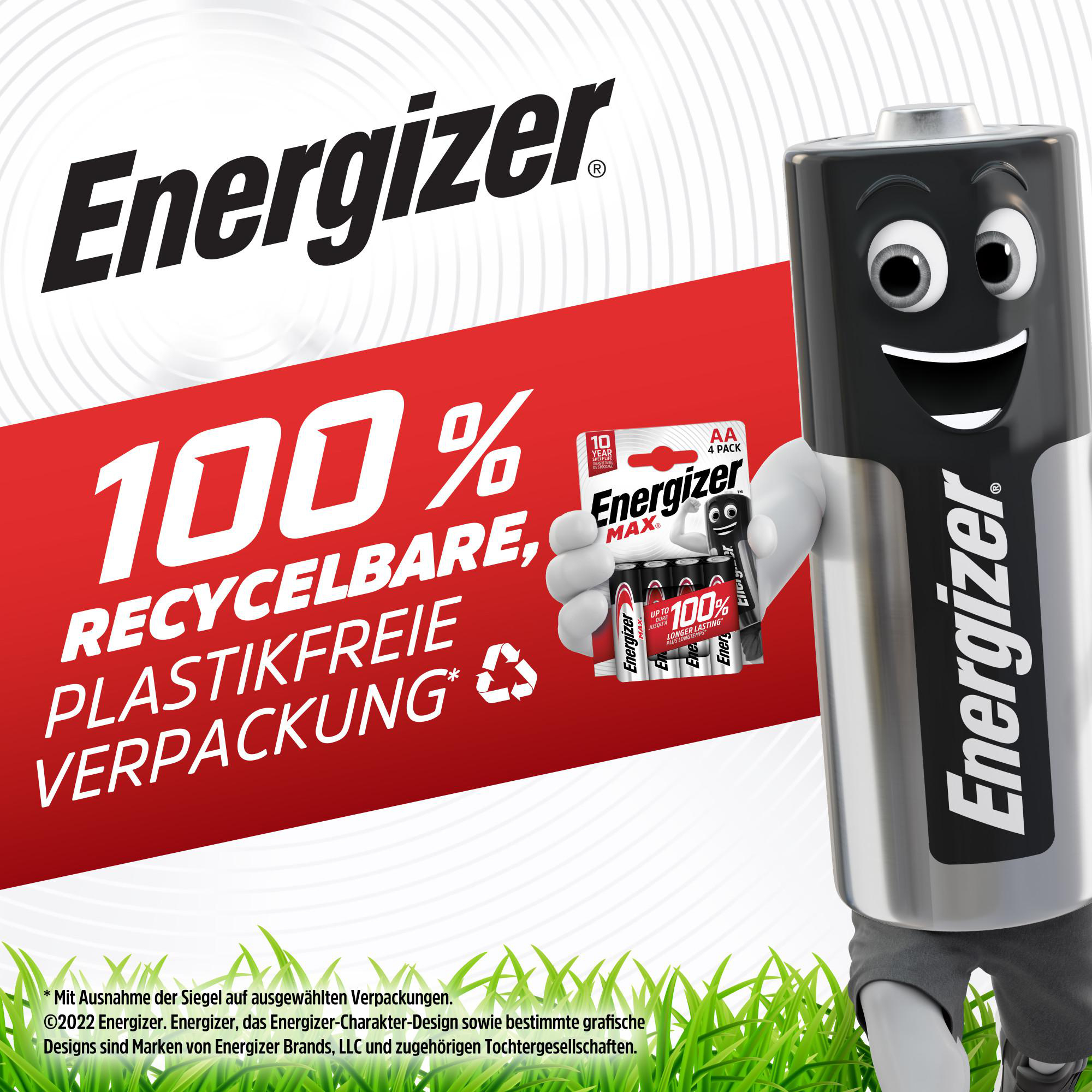 Energizer-Batterie-Figur, die ein Batteriepaket hält, roter Hintergrund mit Text, grünes Gras unten.