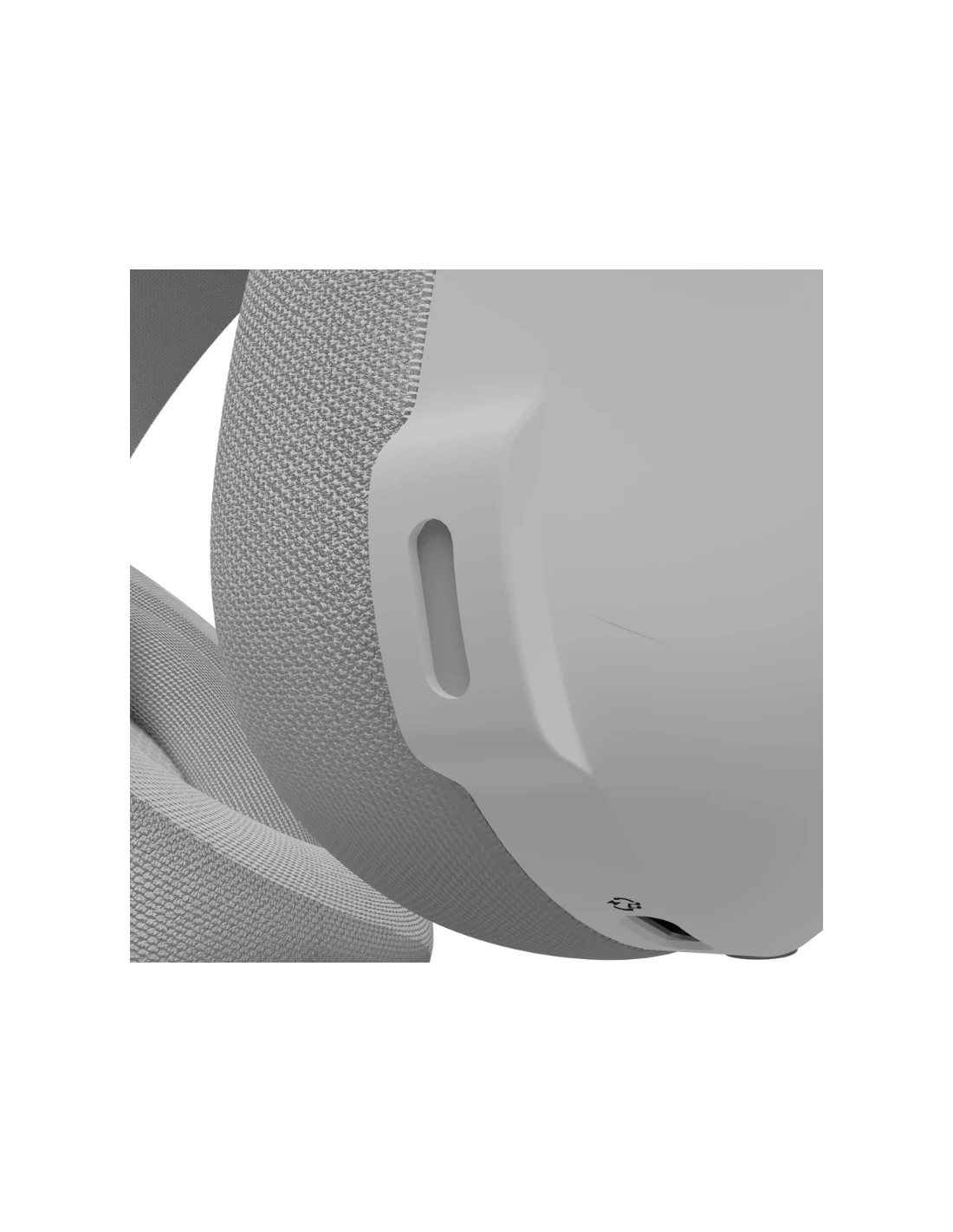 Primer plano de un dispositivo blanco con un lado de tela y una superficie lisa y dura. Se ve un asa curva y un pequeño símbolo.