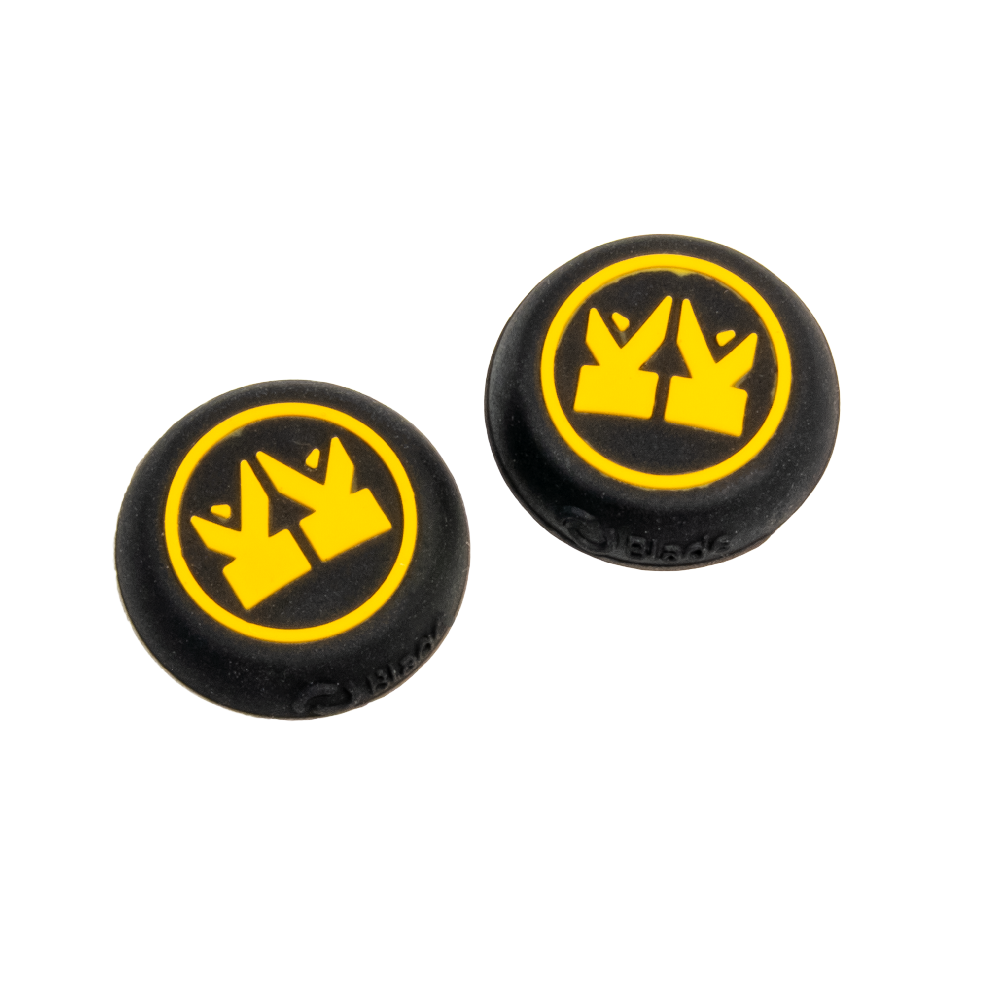 Dos objetos circulares negros con logotipos amarillos. Cada uno tiene un diseño similar a una corona dentro de un círculo amarillo.