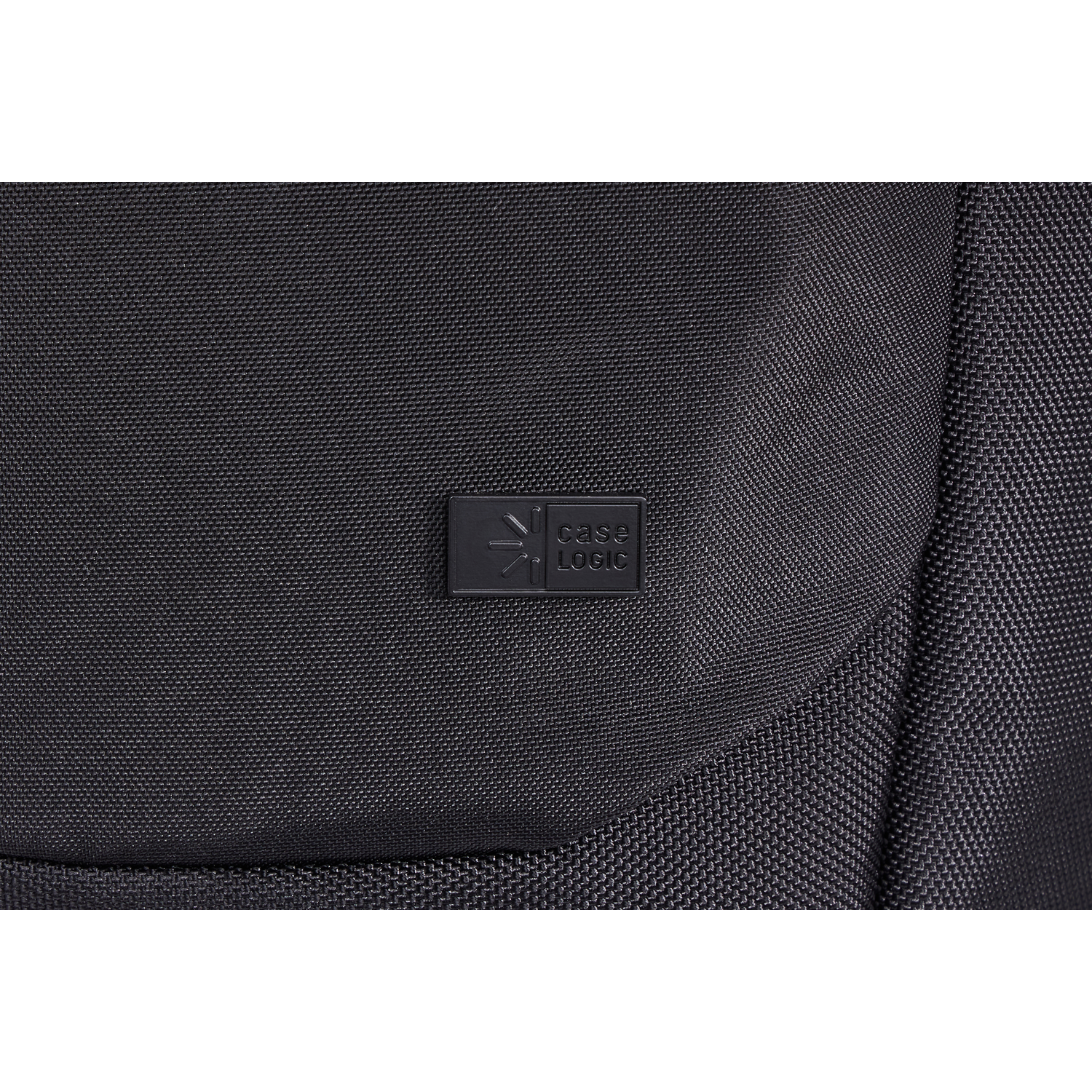 Close-up of a black backpack with a Case Logic logo. The fabric has a textured pattern.