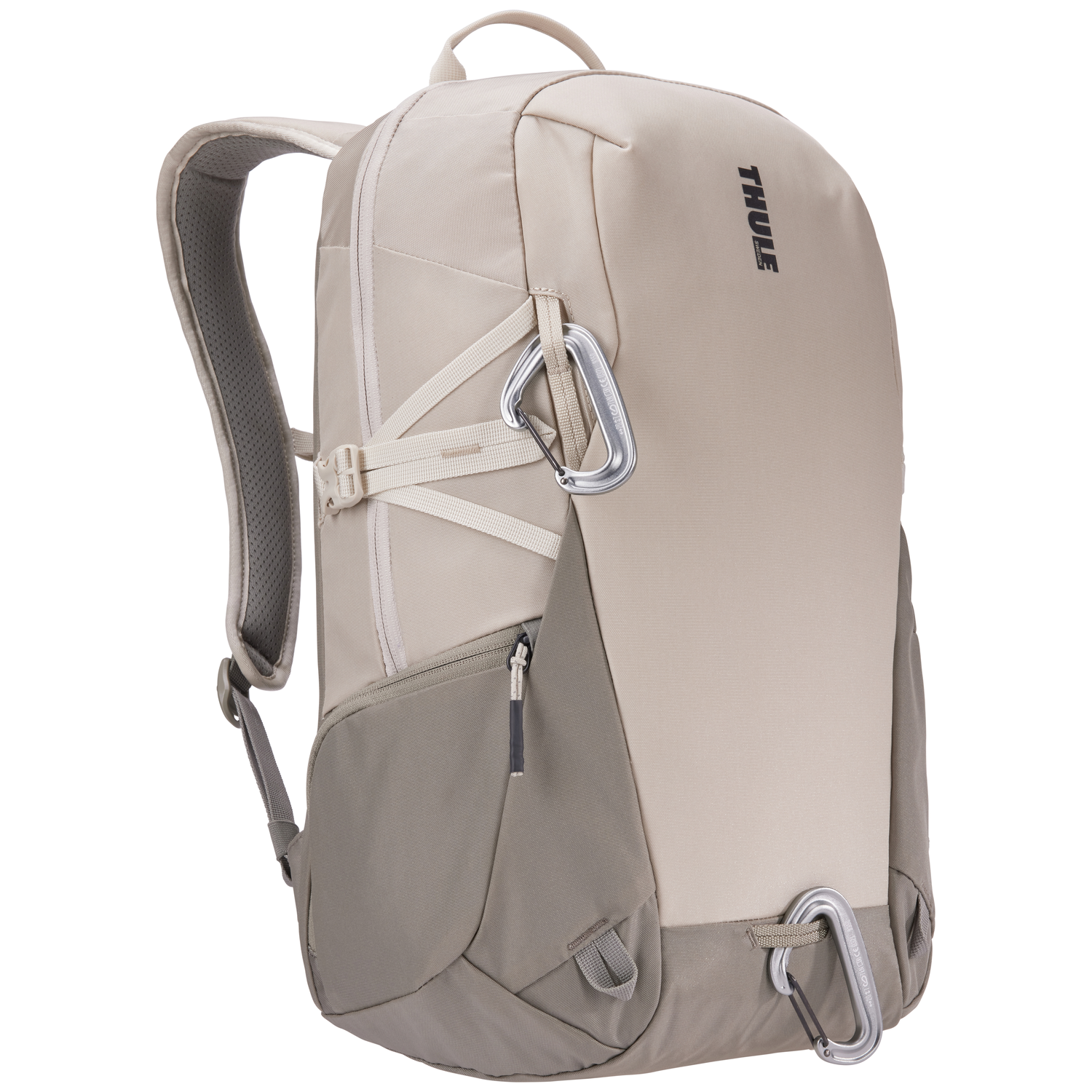 Beige and gray Thule backpack with silver carabiners attached. The backpack has a handle, straps, and a zipper.