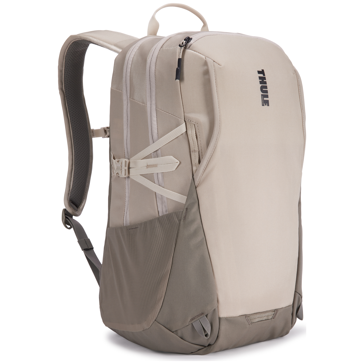 A beige and gray Thule backpack. It has multiple compartments, straps, and a handle. The background is white.