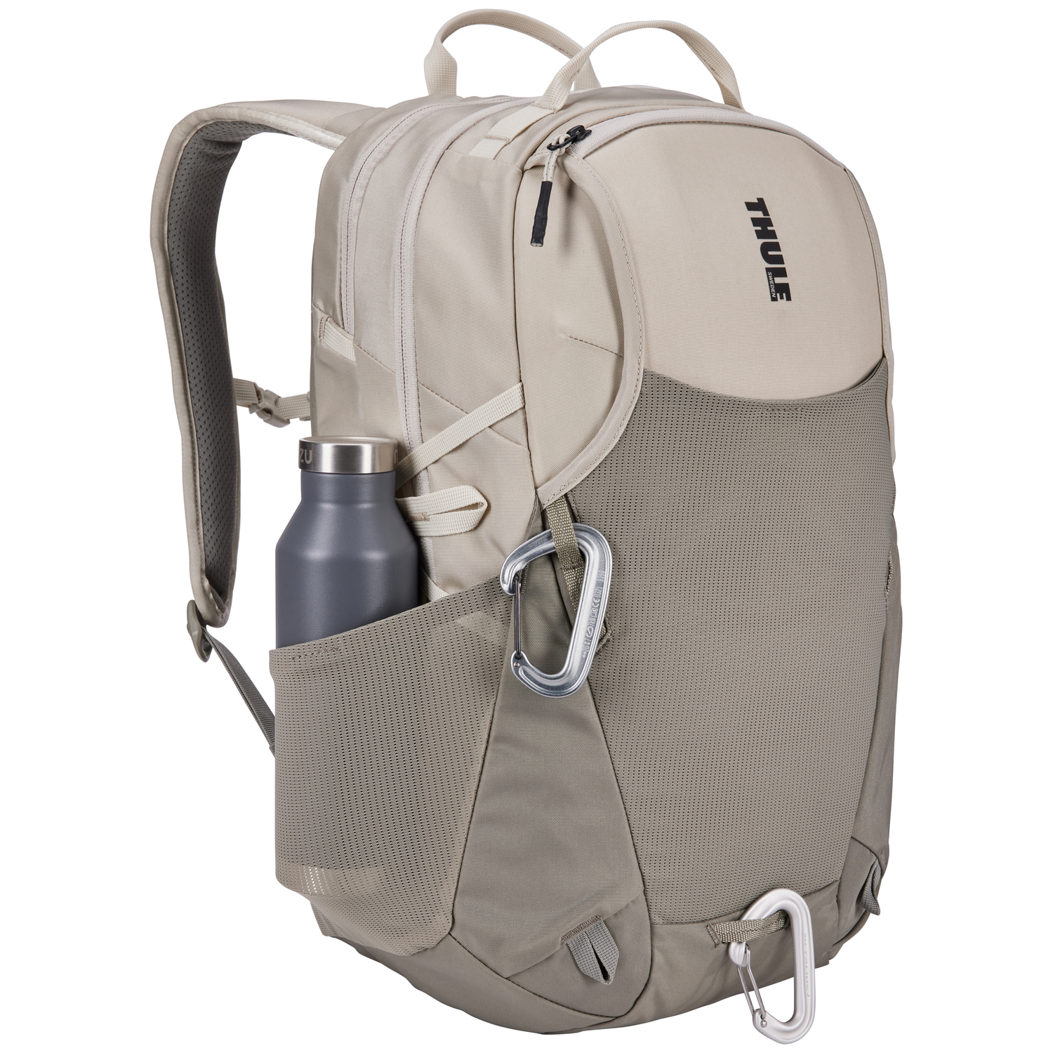 Tan and gray backpack with a water bottle and carabiners. The brand name 'Thule' is visible. The background is white.