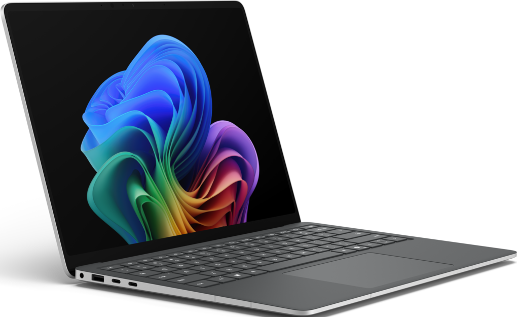 Ein grauer Laptop ist geöffnet und zeigt ein farbenfrohes abstraktes Design auf dem Bildschirm. Tastatur und Trackpad sind sichtbar.