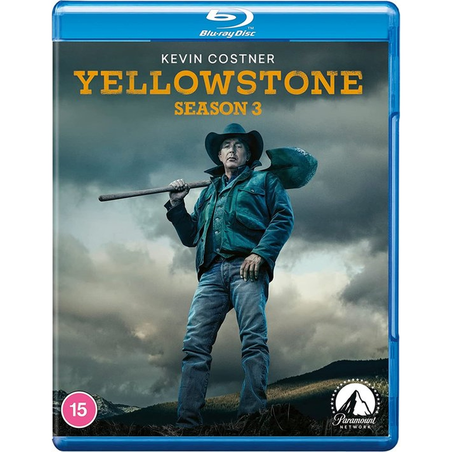 Blu-ray cover for Yellowstone Season 3. Kevin Costner holds a shovel. Cloudy sky and Paramount Network logo are in the background.