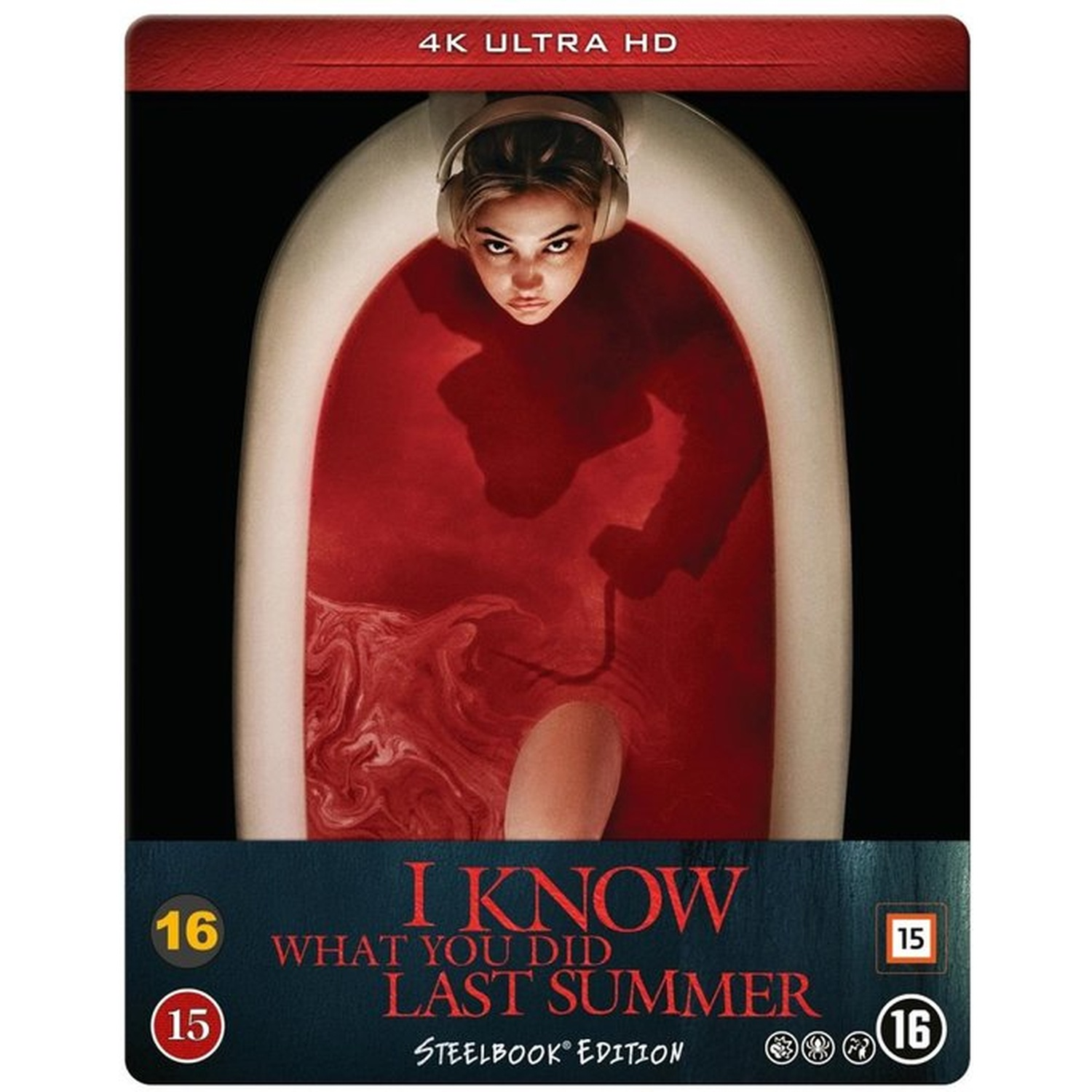 A woman in headphones is in a tub filled with red liquid. It's the cover of 'I Know What You Did Last Summer'.