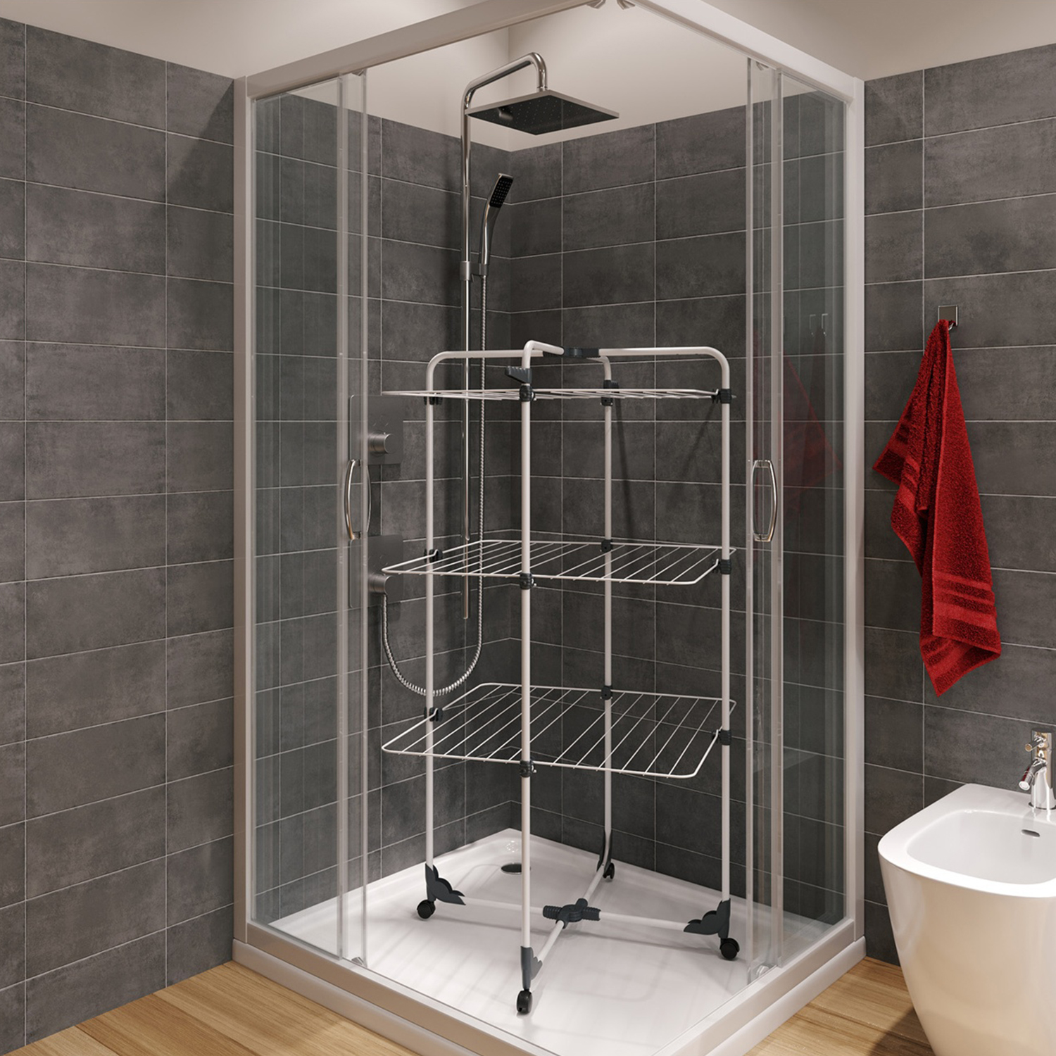 Una cabina doccia con un stendino all'interno. Un asciugamano rosso appeso al muro. Le pareti sono piastrellate in grigio.