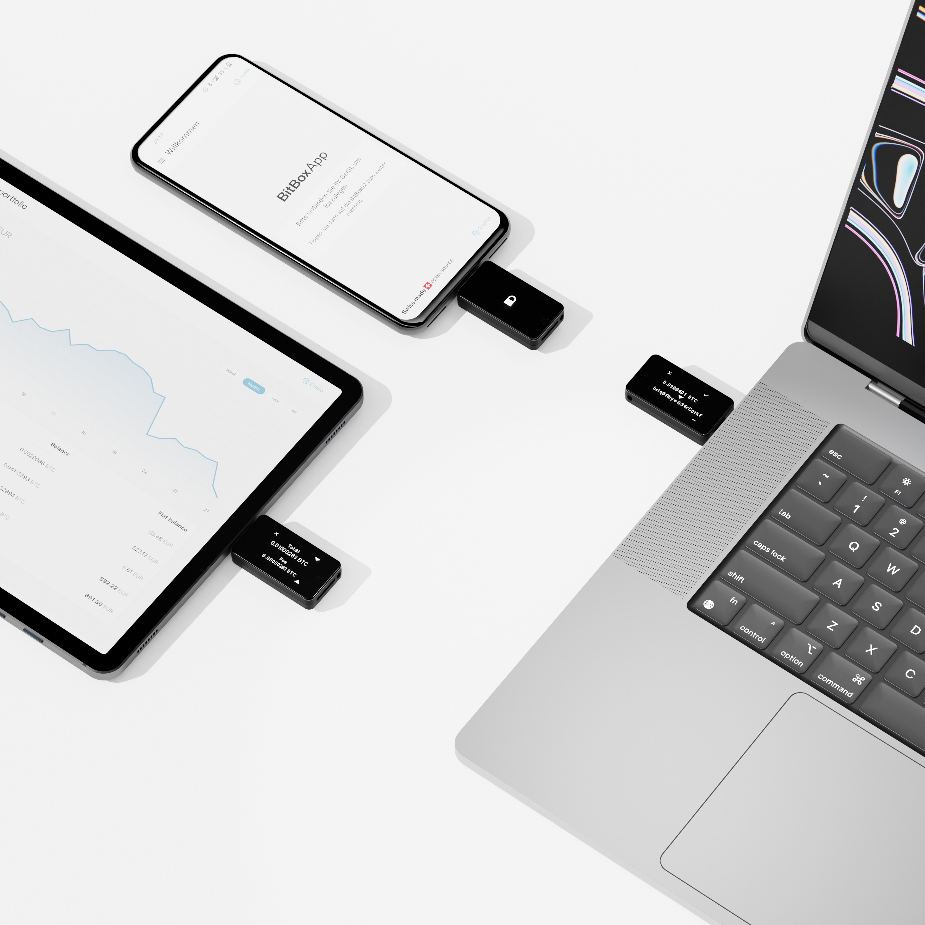Drei Geräte mit BitBox verbunden: Telefon, Tablet und Laptop. Schwarze Geräte und weißer Hintergrund.