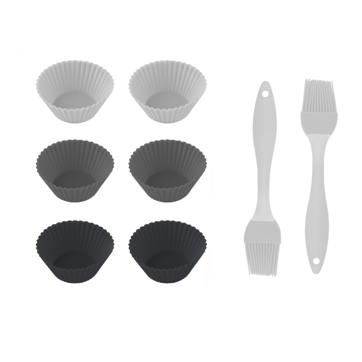 La imagen muestra seis moldes de silicona para magdalenas en blanco, gris y negro. Dos blancos y dos grises. También se ven dos pinceles.