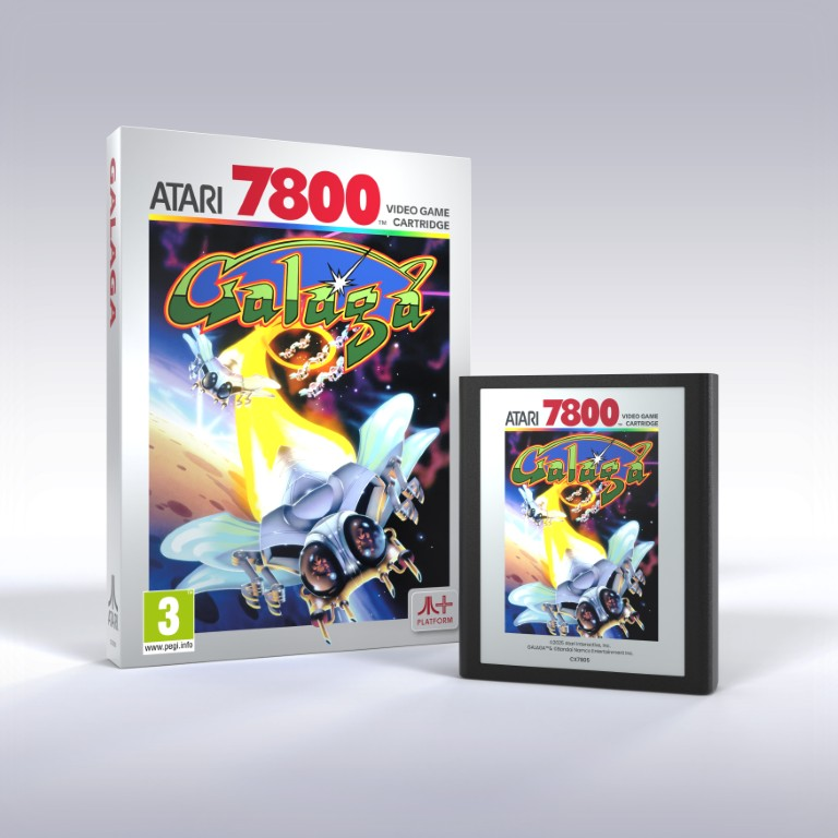 Obrazek przedstawia kartridż do gry wideo Atari 7800 i jego pudełko dla Galaga. Pudełko i kartridż są odpowiednio białe i czarne.