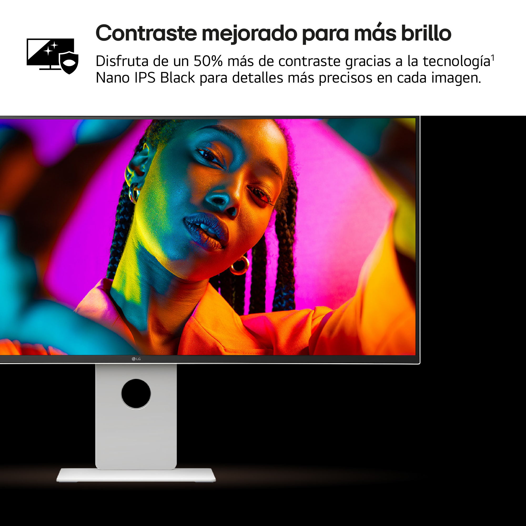 El rostro de una mujer iluminado con colores vibrantes en una pantalla de computadora. La pantalla está en un monitor blanco con fondo negro.