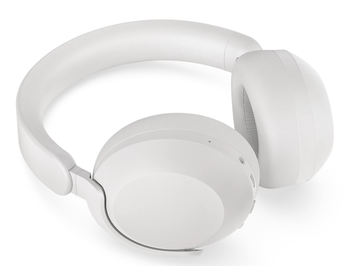 Białe słuchawki na białej powierzchni. Słuchawki są w stylu nausznym.
