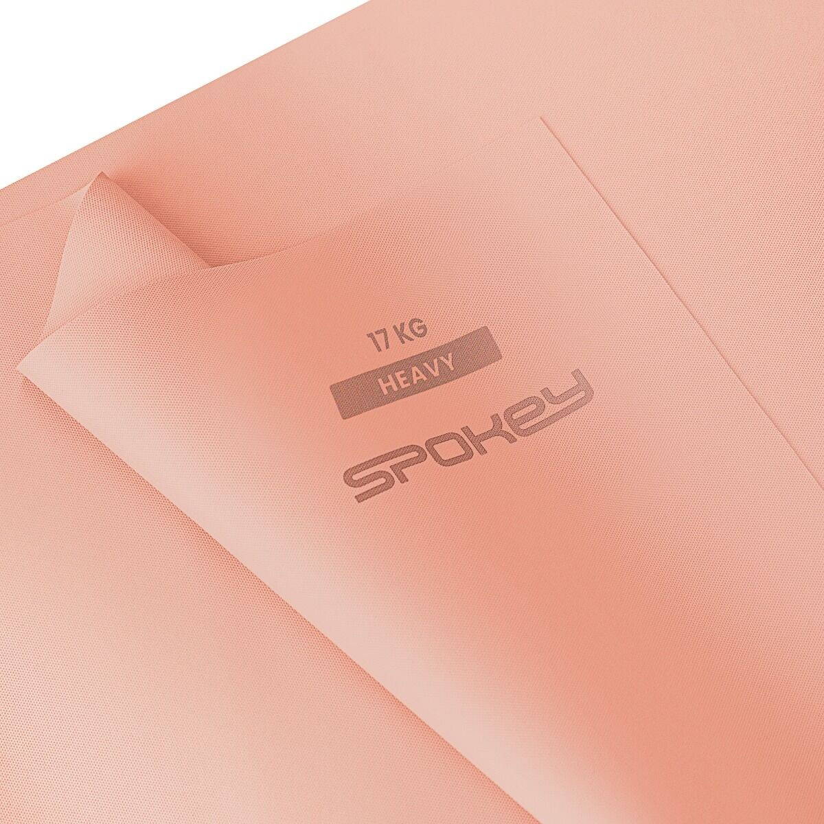Różowa mata do ćwiczeń z napisem: 17 KG HEAVY SPOKEY. Mata jest złożona. Tło również jest różowe.