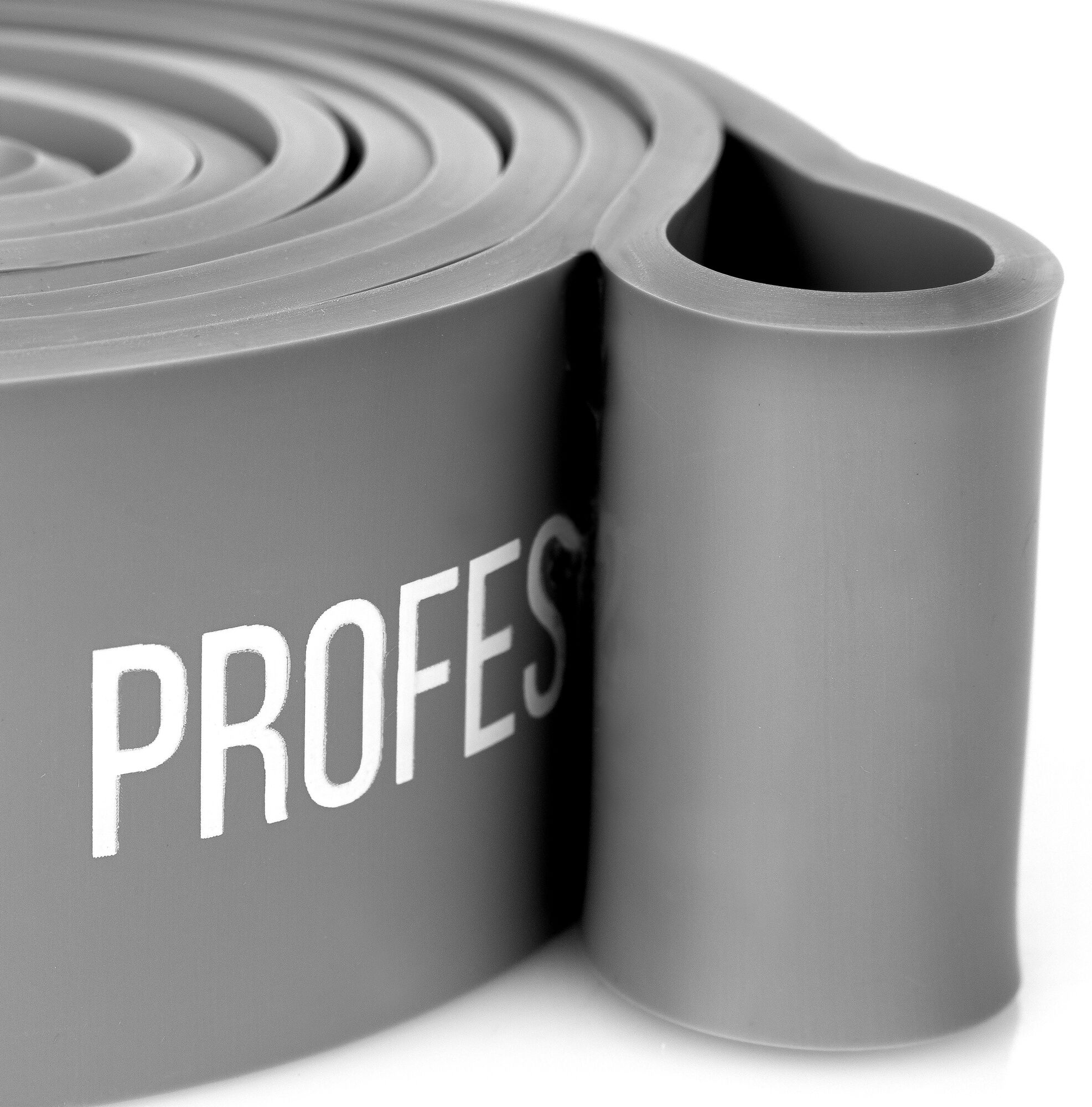 Zbliżenie szarej taśmy oporowej z białym napisem 'PROFES'. Taśma jest zwinięta.