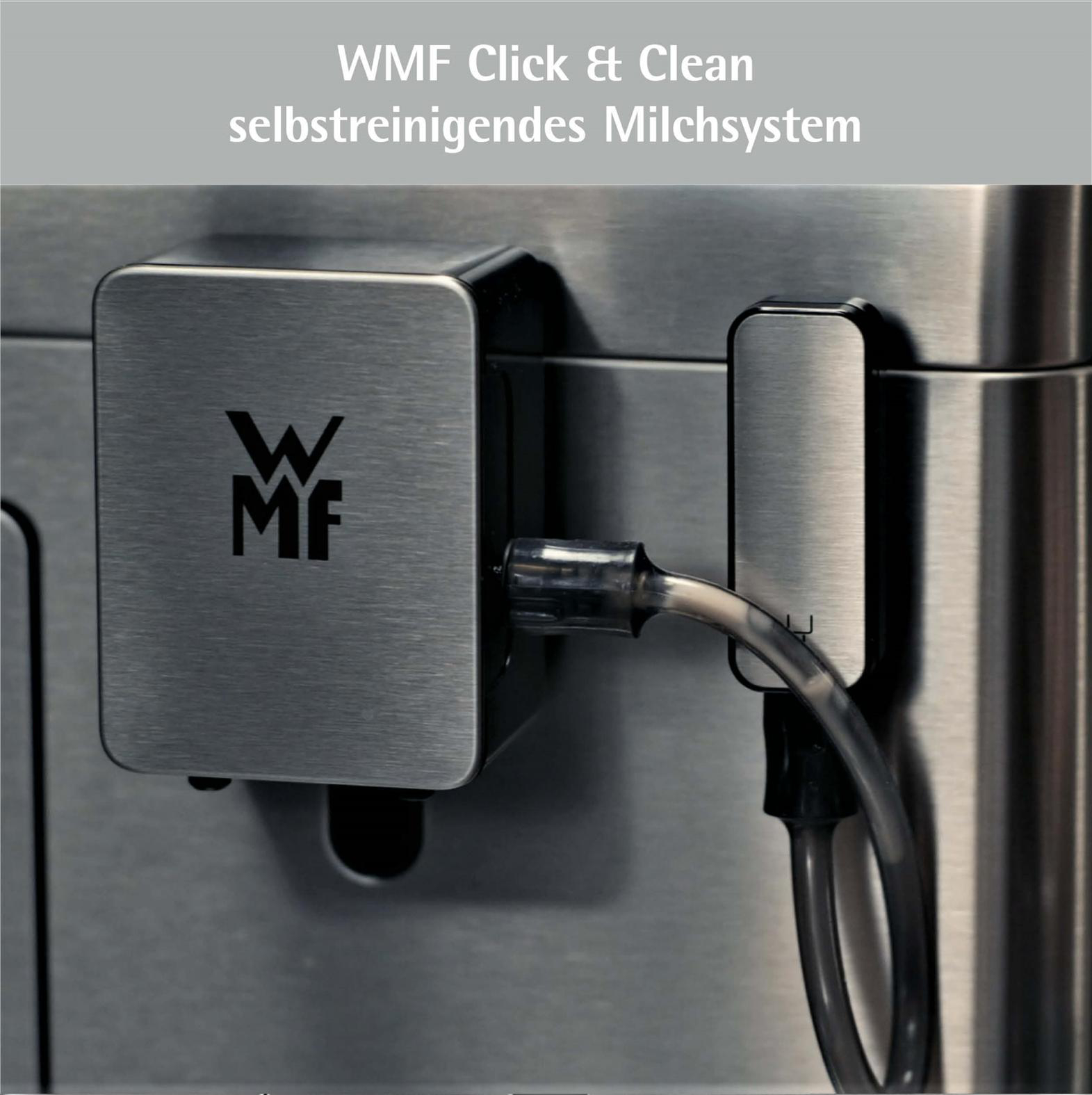 Nahaufnahme einer Edelstahl-Kaffeemaschinenkomponente mit WMF-Logo, Schlauch und den Worten 'Click & Clean'.