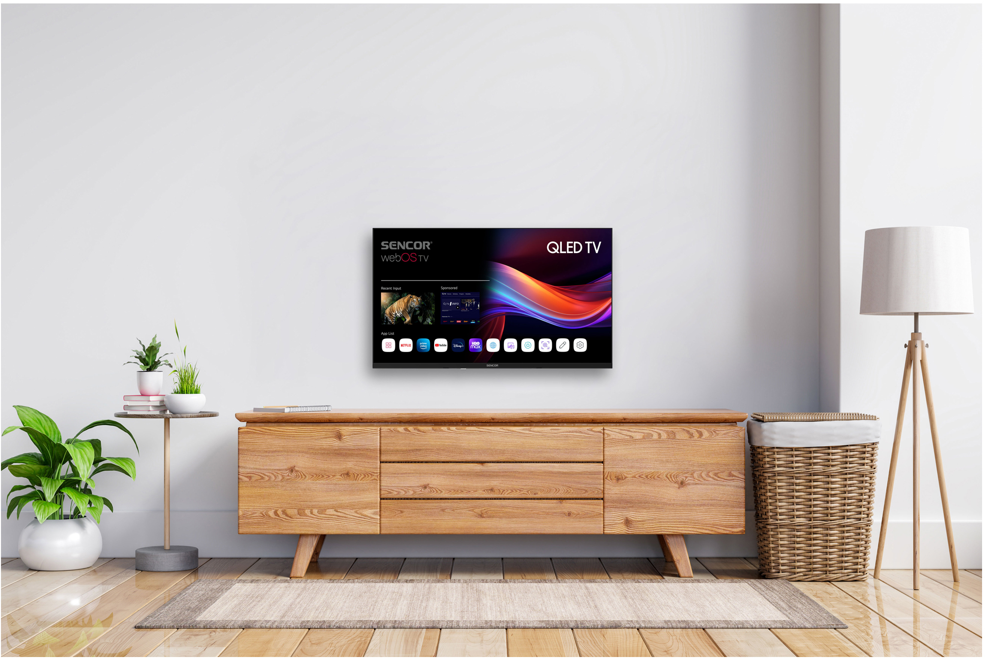 Nappali TV-vel, fa szekrénnyel, növényekkel, lámpával és szőnyeggel. A TV színes felületet jelenít meg.