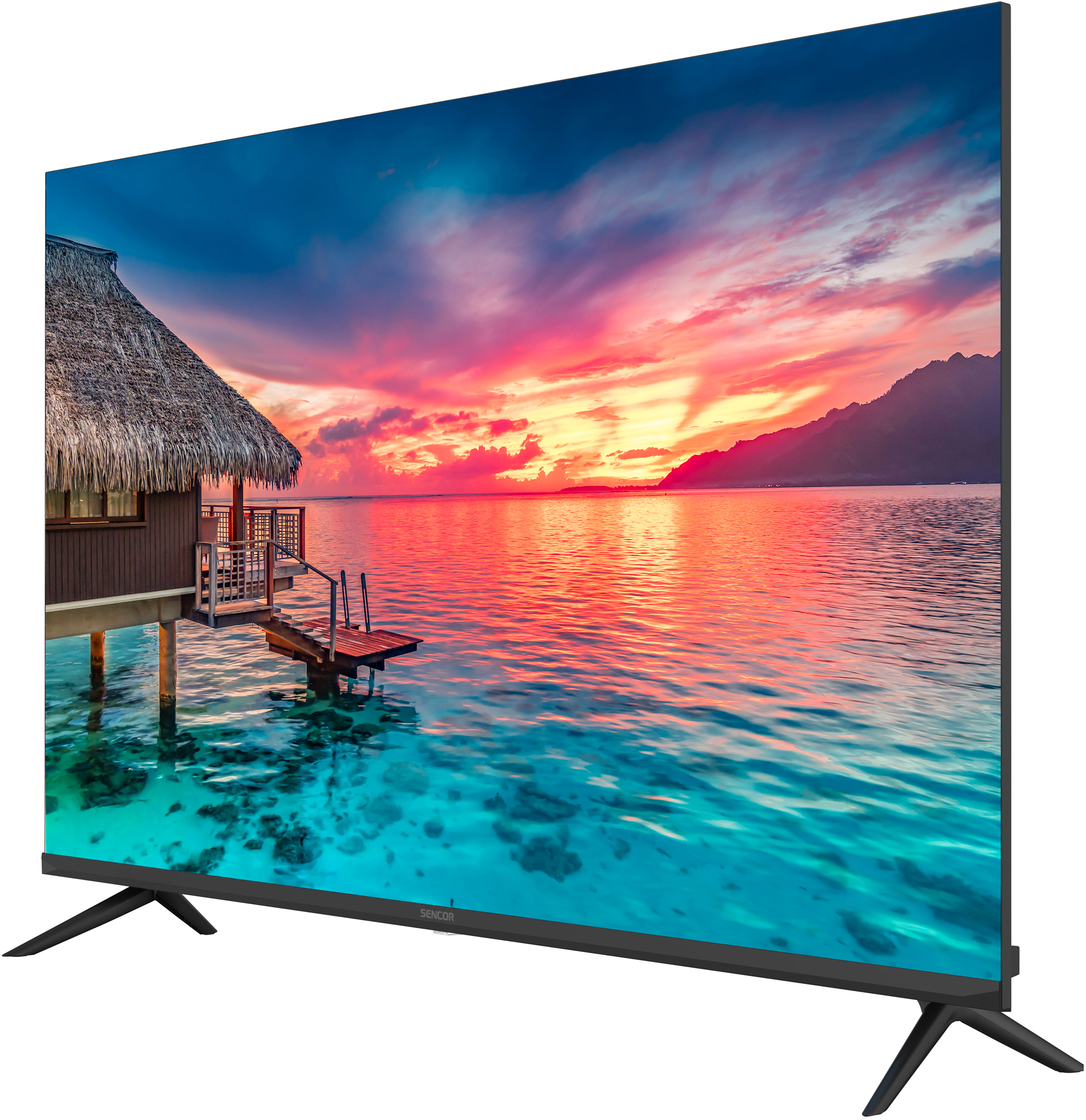 A TV a naplementét mutatja a vízen, cölöpökön álló kunyhóval. Az ég rózsaszín és kék. A TV-nek fekete lábai vannak.