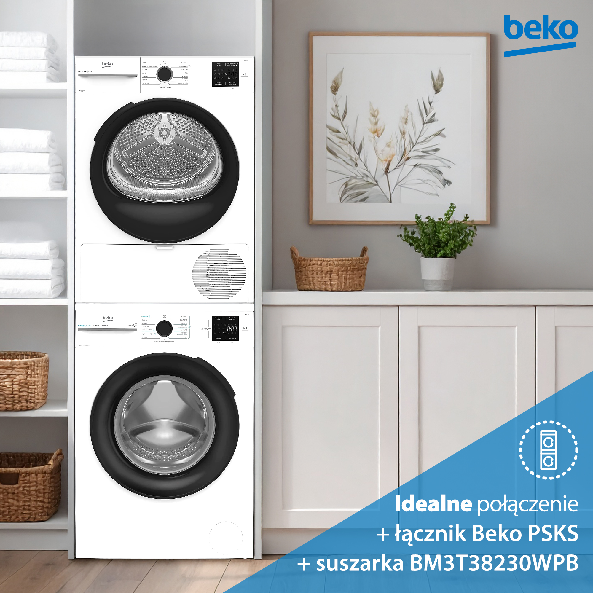 Ułożona biała pralka i suszarka Beko. Oprawiony nadruk kwiatowy wisi nad szafką z rośliną.