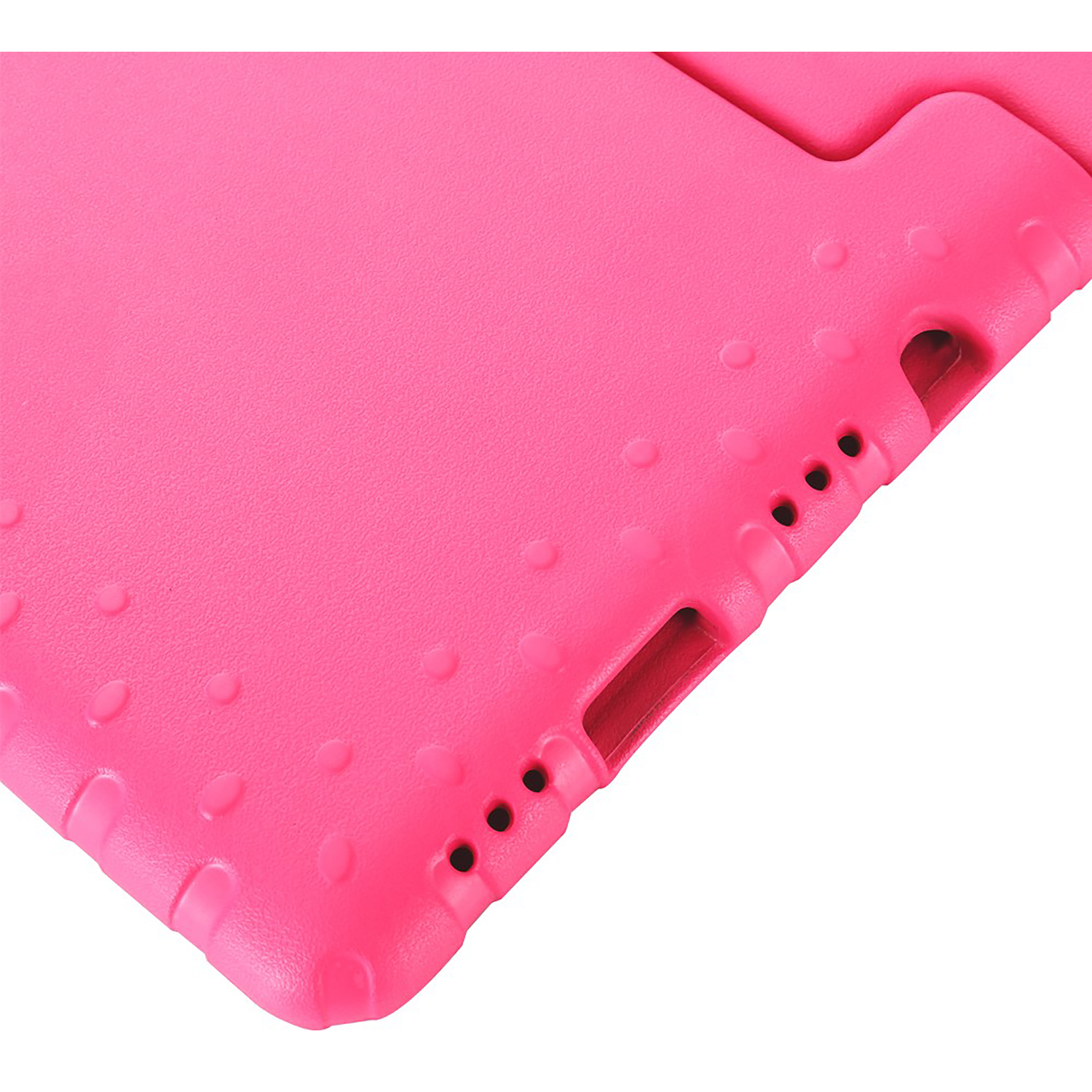 Close-up of a pink tablet case. It has a textured surface with small bumps. There are holes and a port on the side of the case.