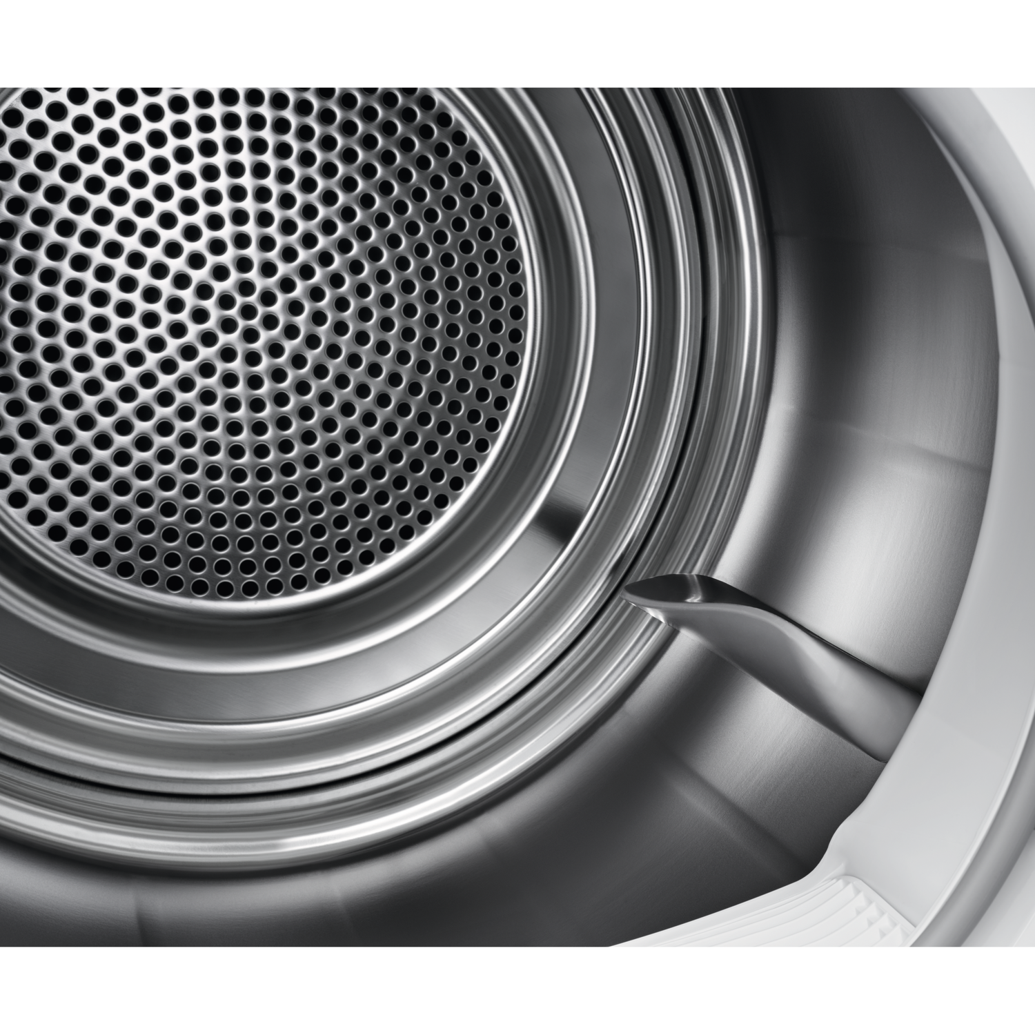 Inside of a dryer drum. Perforated metal front. Silver metal interior and white plastic components.