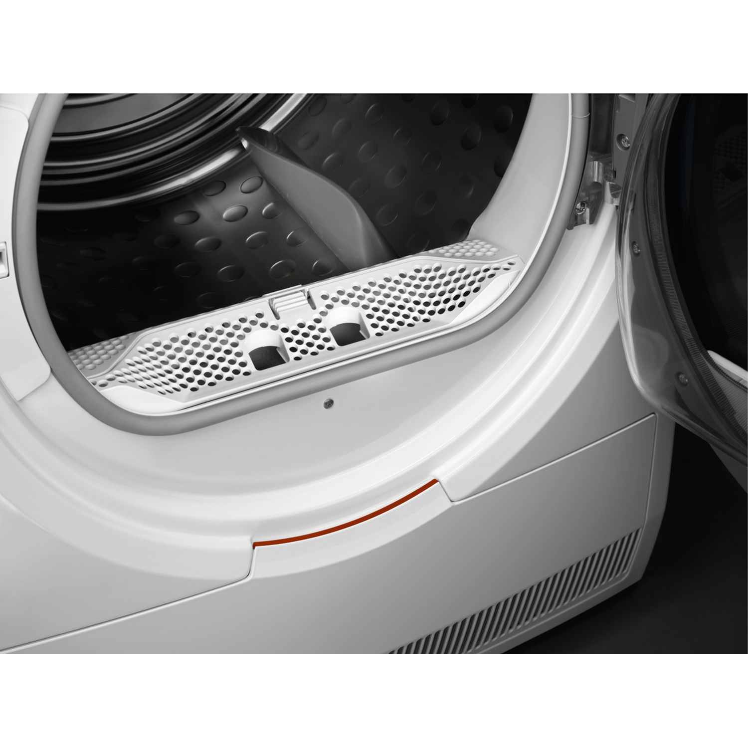 Open white dryer door with perforated filter and dark interior drum. Red line detail on the frame. The door is ajar.