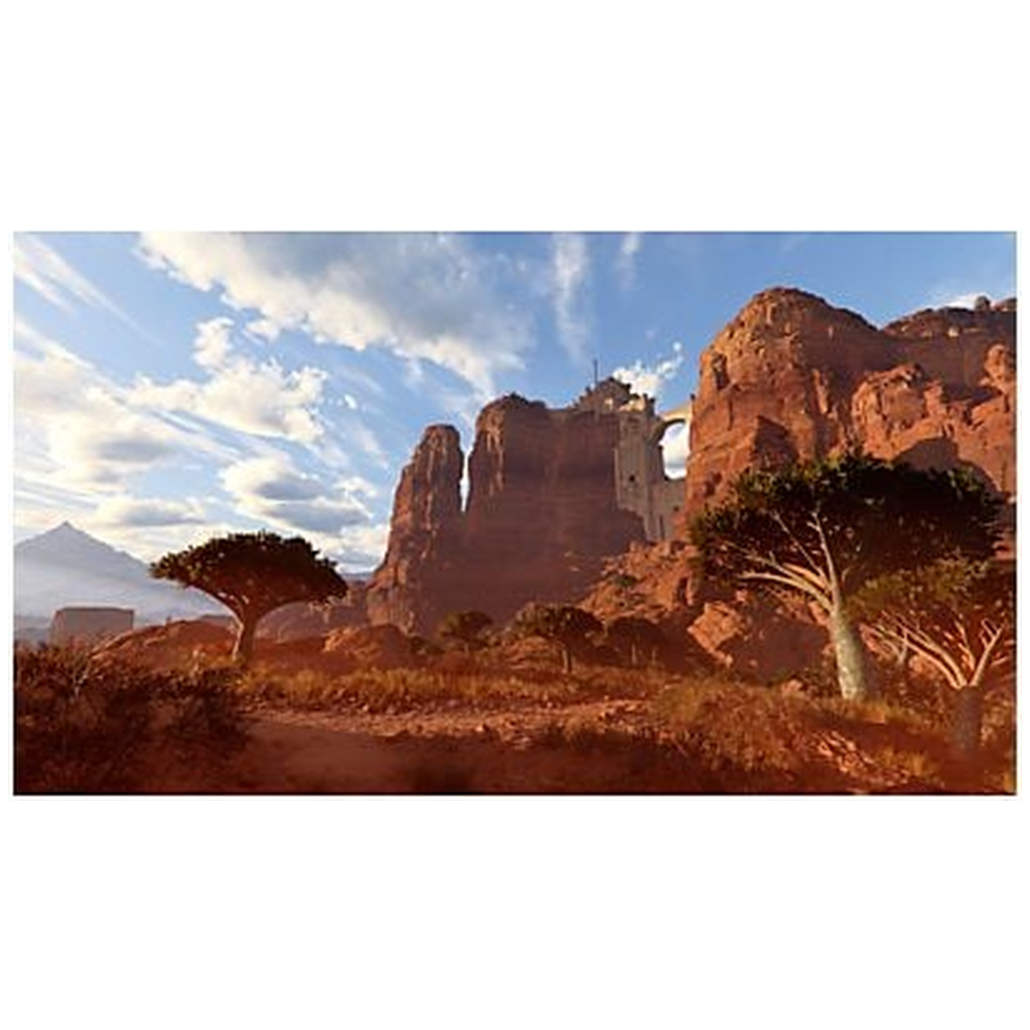 Desert landscape with red rock formations, trees, and a fortress. Blue sky with clouds in the background. 