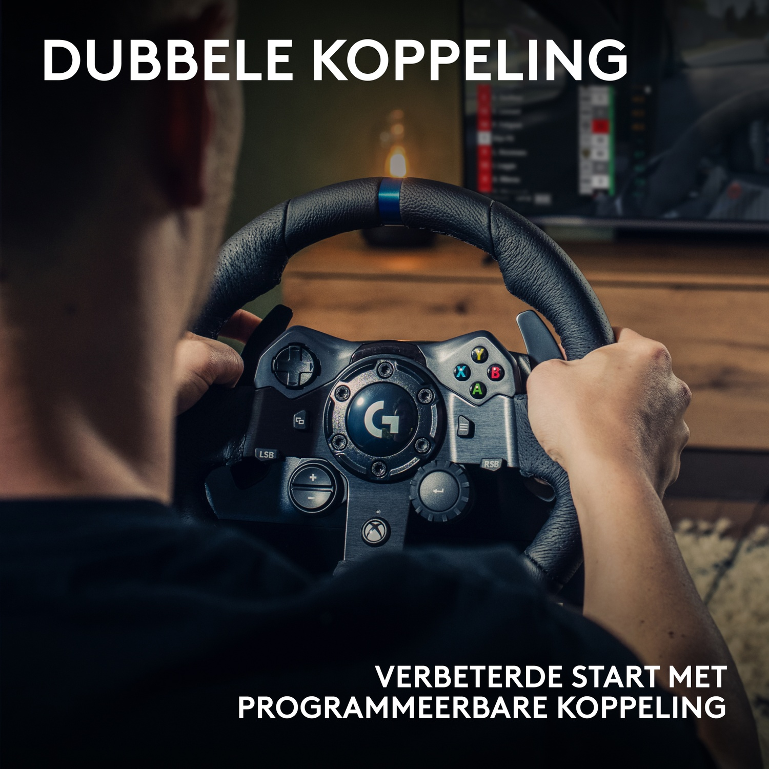 A person holding a black steering wheel with buttons. The wheel has a blue stripe. Text at the top and bottom.