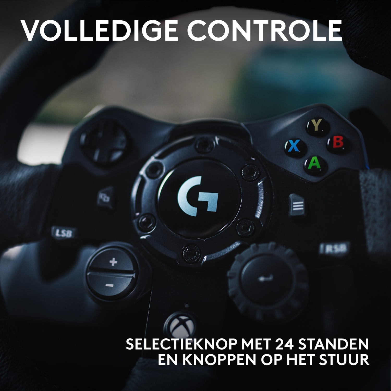 Close-up of a black steering wheel with buttons and a central dial with the letter 'G'. The wheel is labeled 'LSB' and 'RSB'.