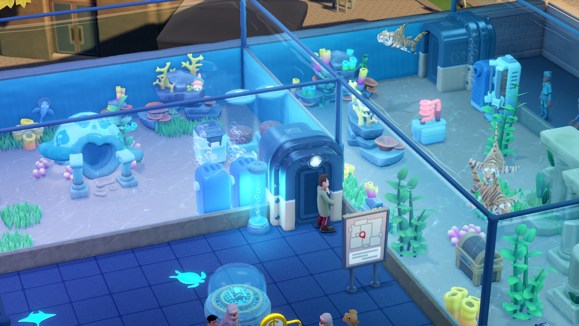 Una scena di acquario con habitat sottomarini, tigri e una persona vicino a una mappa. Coralli e piante colorate decorano i serbatoi.