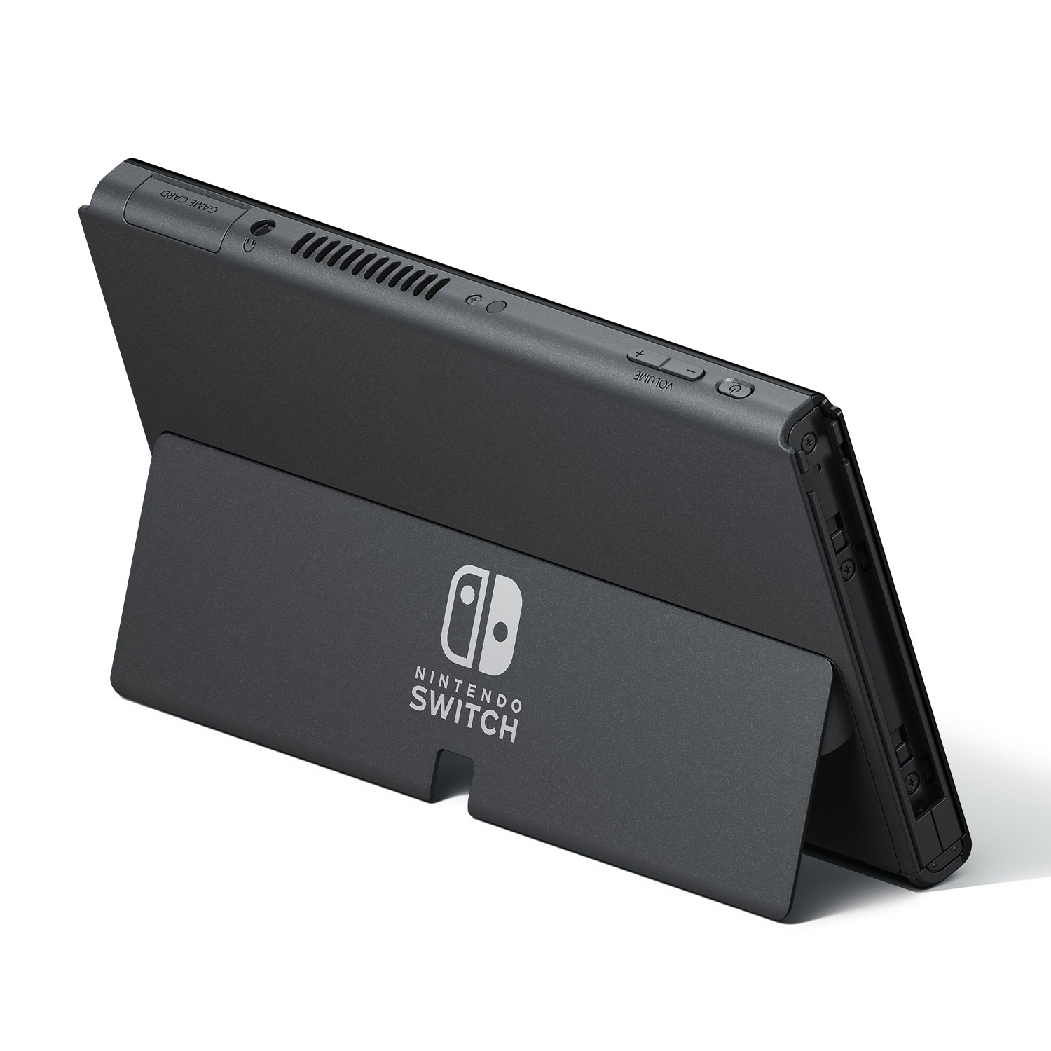 Una console Nintendo Switch nera è sostenuta dal suo supporto. La console ha pulsanti del volume e uno slot per schede di gioco.
