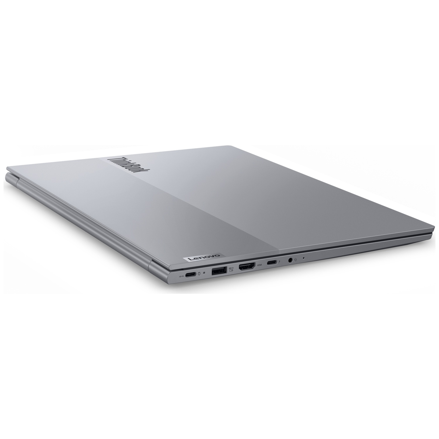 Un ordinateur portable argenté fermé avec les logos ThinkBook et Lenovo visibles. L'ordinateur portable est sur fond blanc.