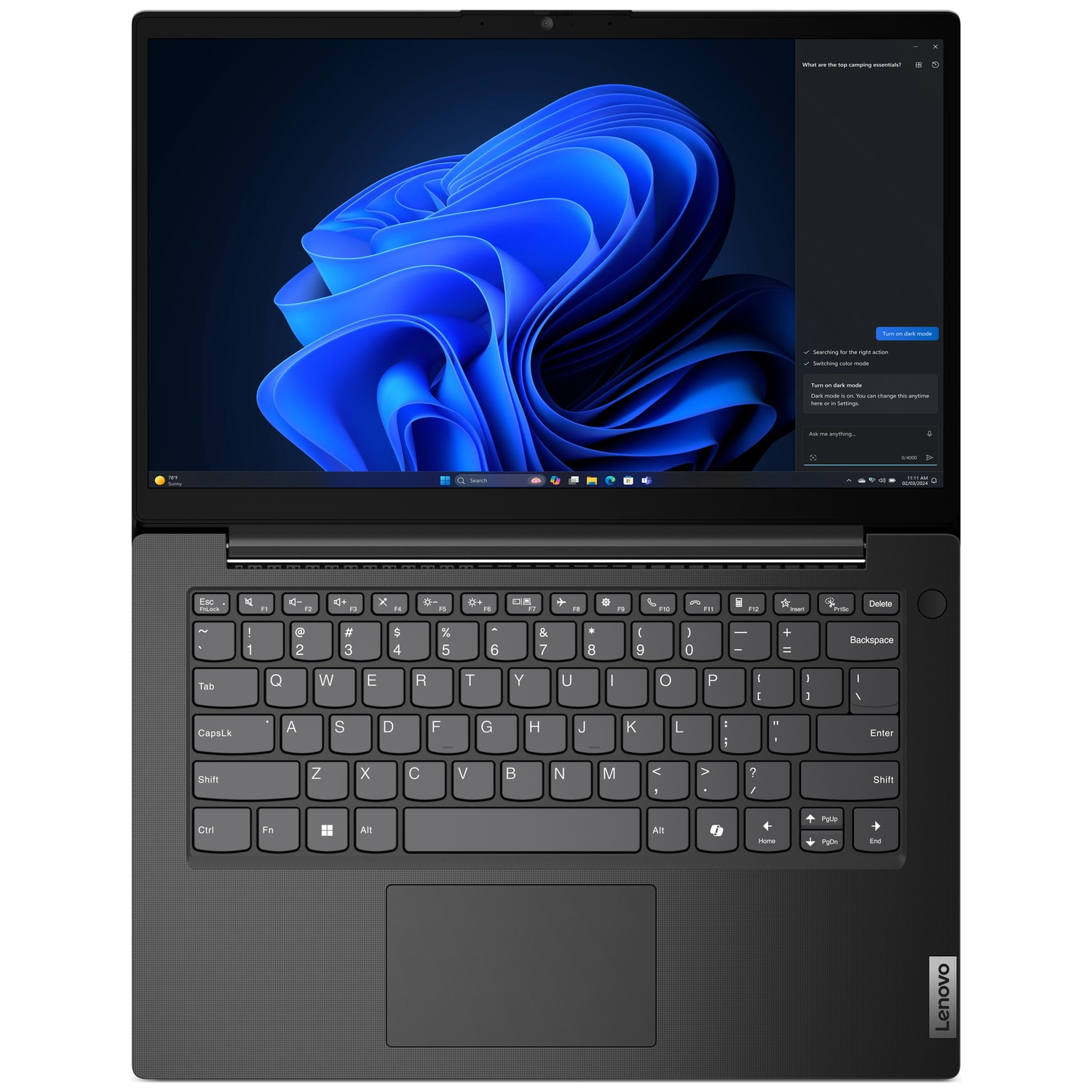 A Lenovo laptop is open, displaying a dark blue abstract image. The keyboard is visible, and a sidebar is on the screen.