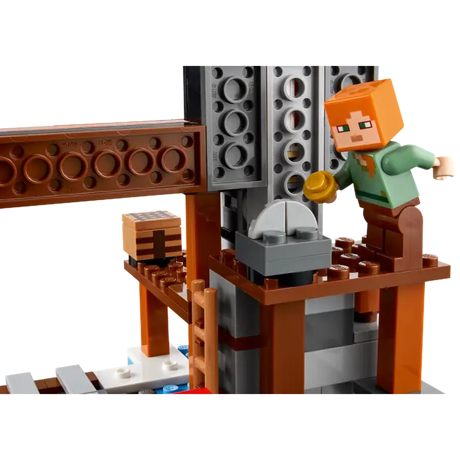 A Lego scene. A figure holds a gold disc near a saw. There are brown, gray, and tan blocks. A ladder is also present.